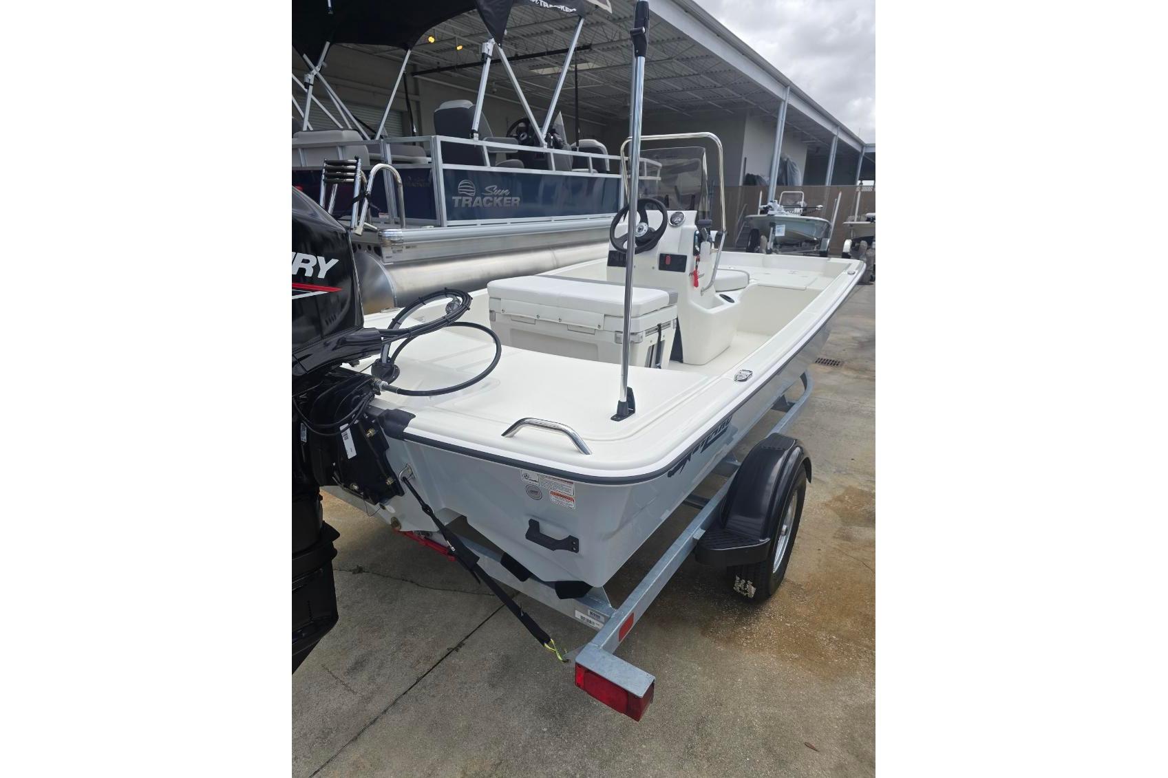 2026 Mako Pro Skiff 15 CC boat on trailer, featuring a sleek design and spacious deck.