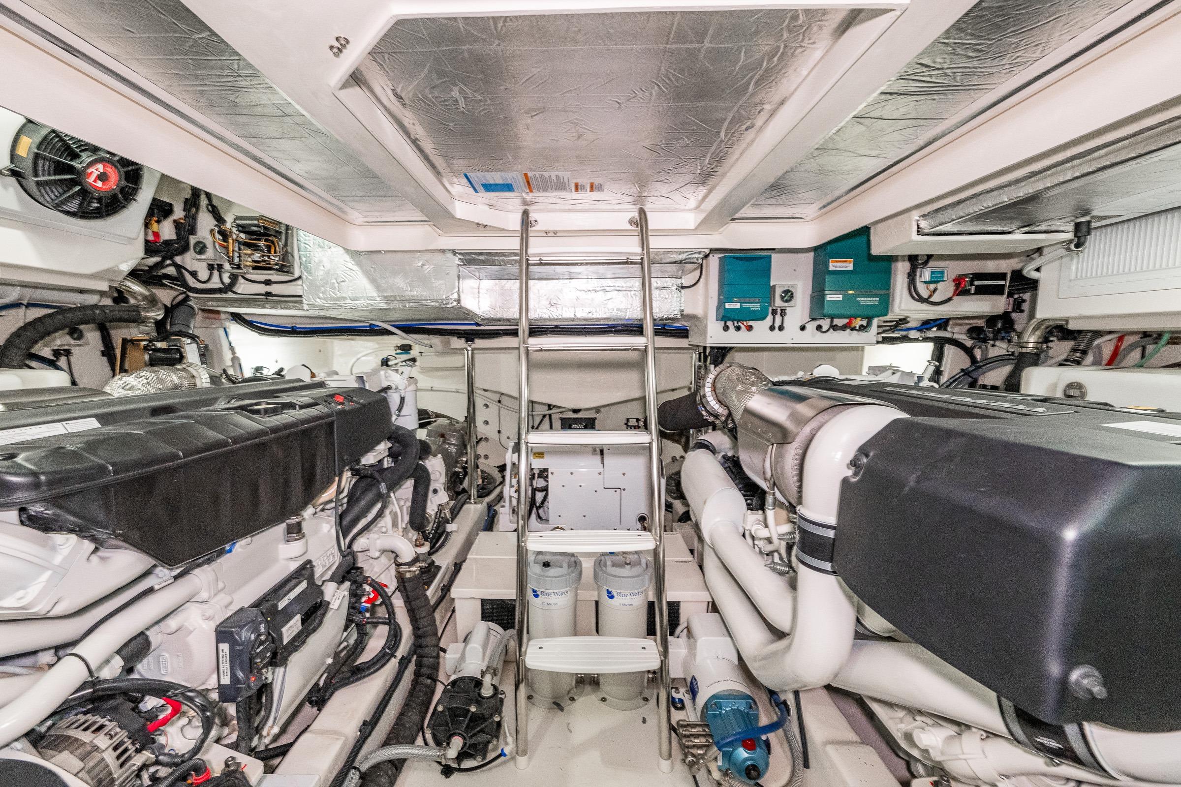 Engine room of 2026 Riviera 505 SUV, showcasing advanced marine machinery and equipment.
