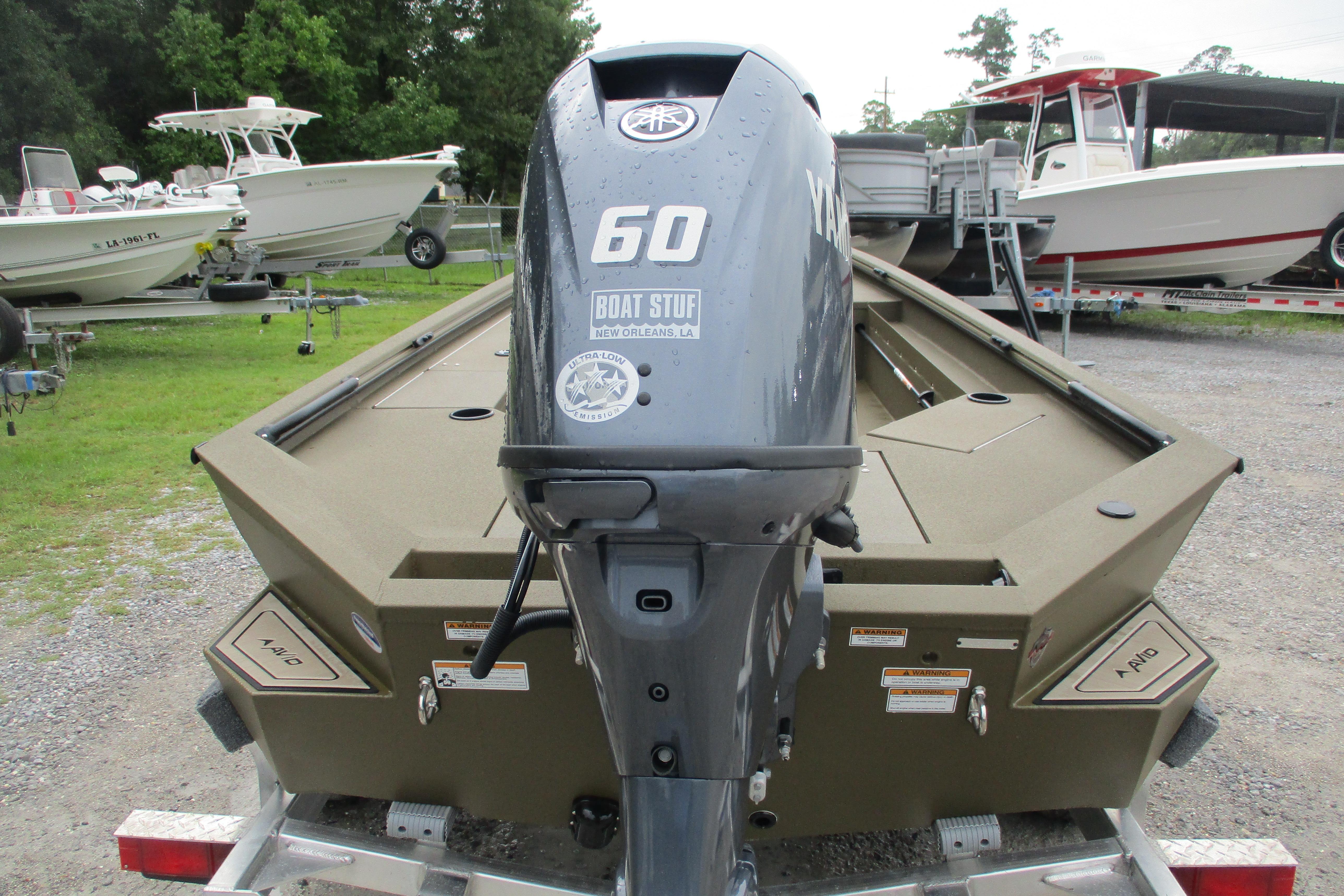 Avid 16 Commander 2026 boat with Yamaha 60 engine, parked on a trailer.