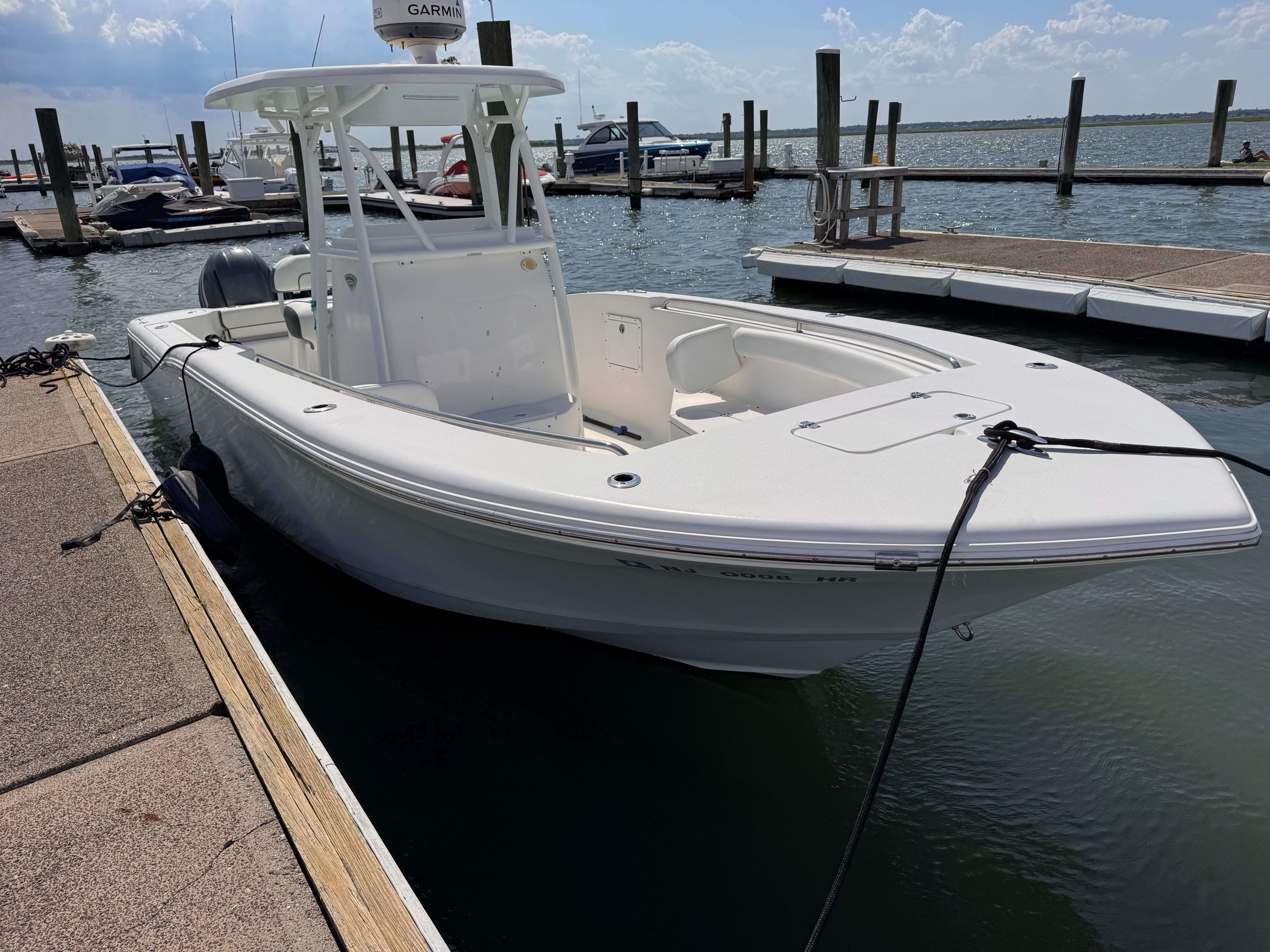 2015 Tidewater 250 Adventure docked at a marina.