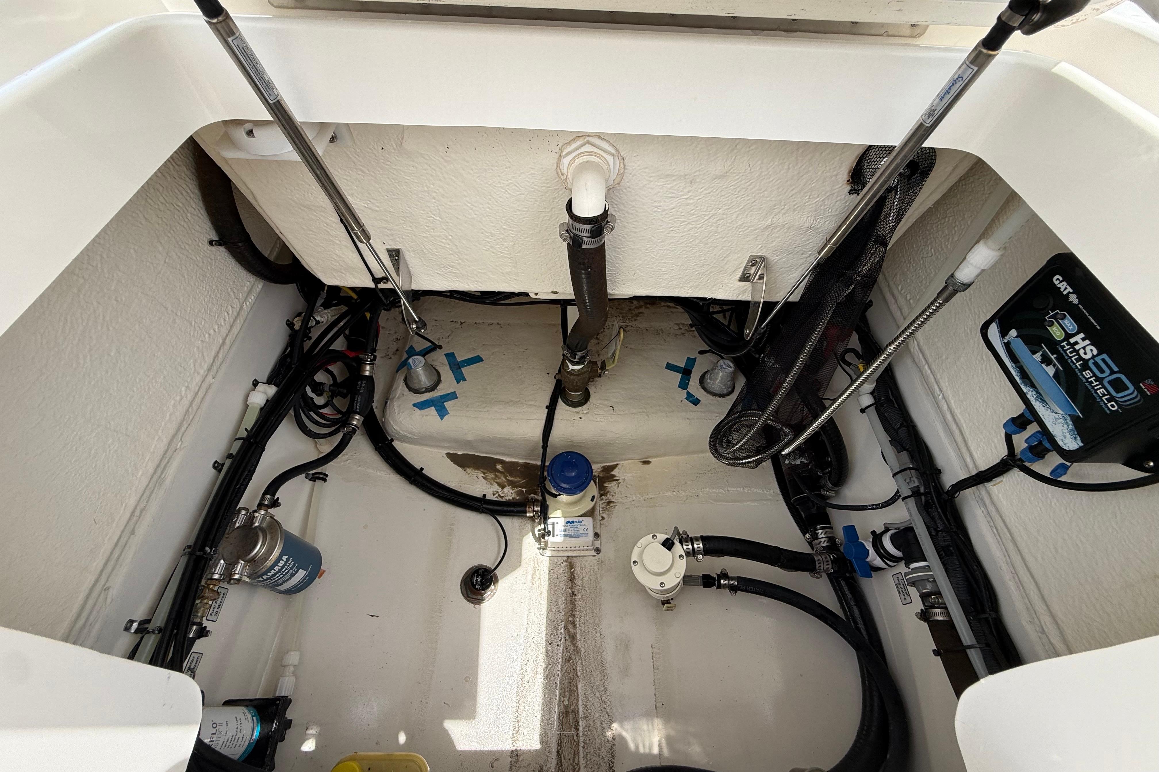 2019 Regulator 26XO boat engine compartment with visible wiring and components.