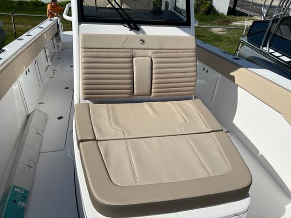 2023 Edgewater 340CC boat interior with beige seating and white deck.