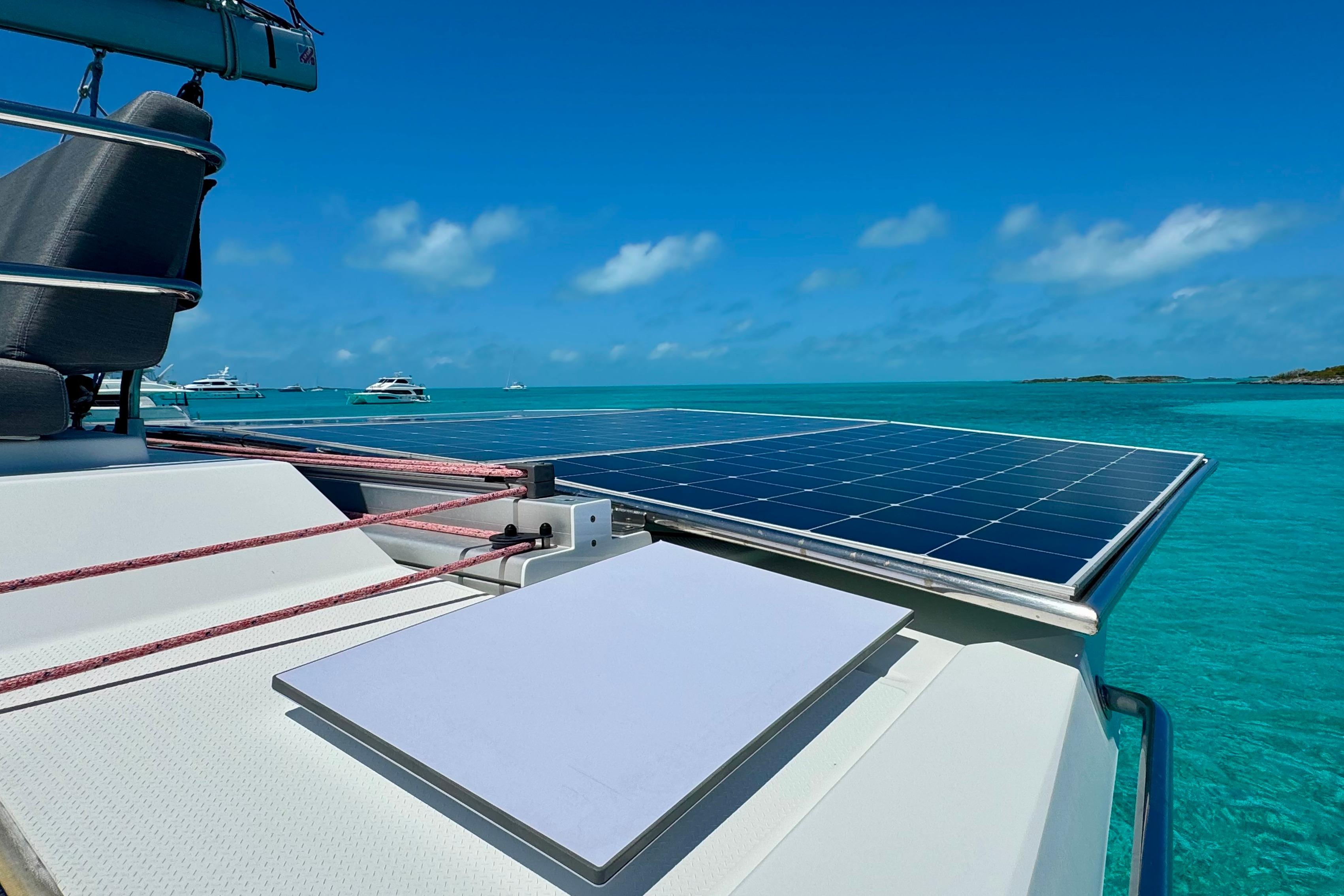 2020 Fountaine Pajot Saona 47 catamaran with solar panels on turquoise sea.