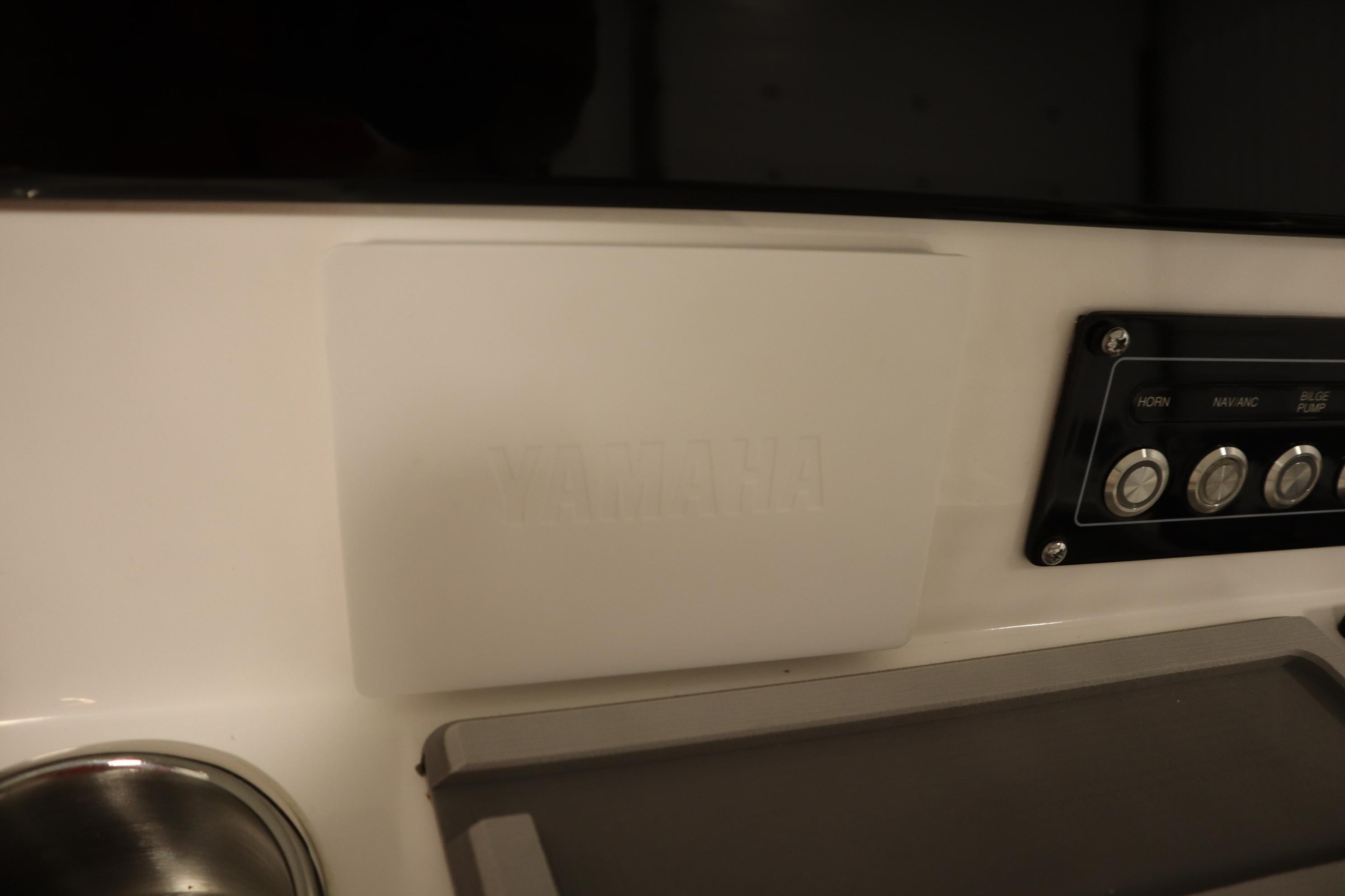 2026 Sea Fox 228 Commander dashboard with control panel and cup holder.