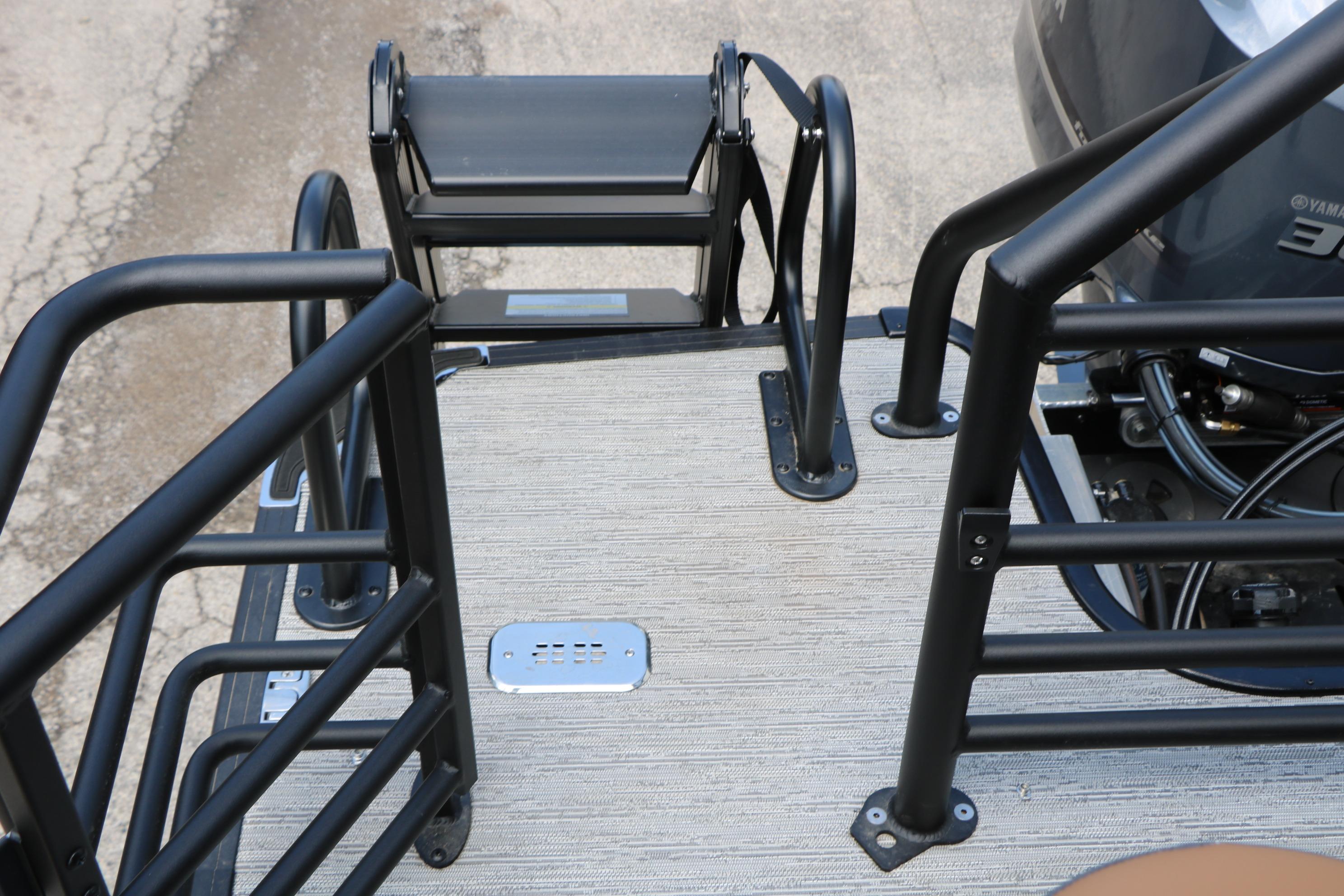 Rear deck of 2026 Sylvan L3 DLZ Bar Platinum Edition Tri-Toon with safety rails.