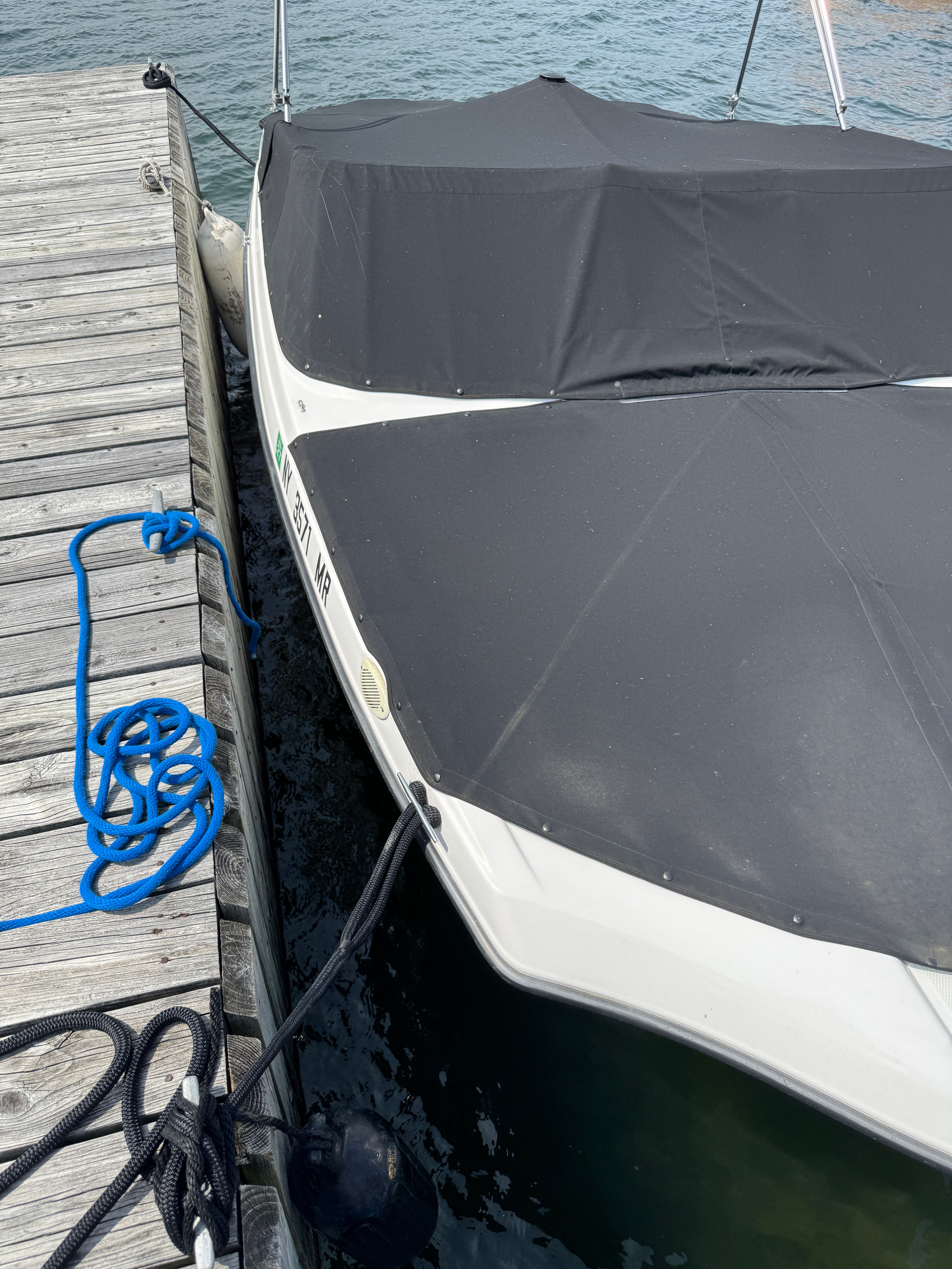 Yamaha SX190 boat 2020 docked with cover.