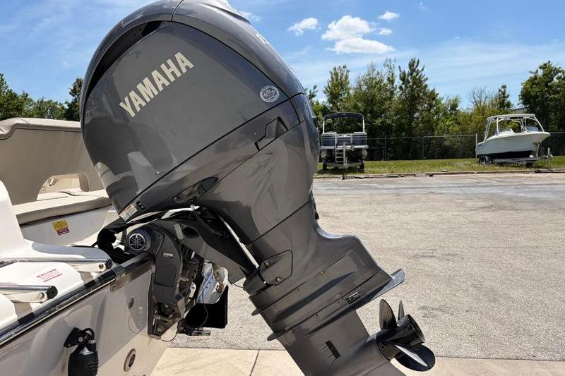 2024 Key West 203 FS boat with Yamaha outboard motor in a sunny outdoor setting.