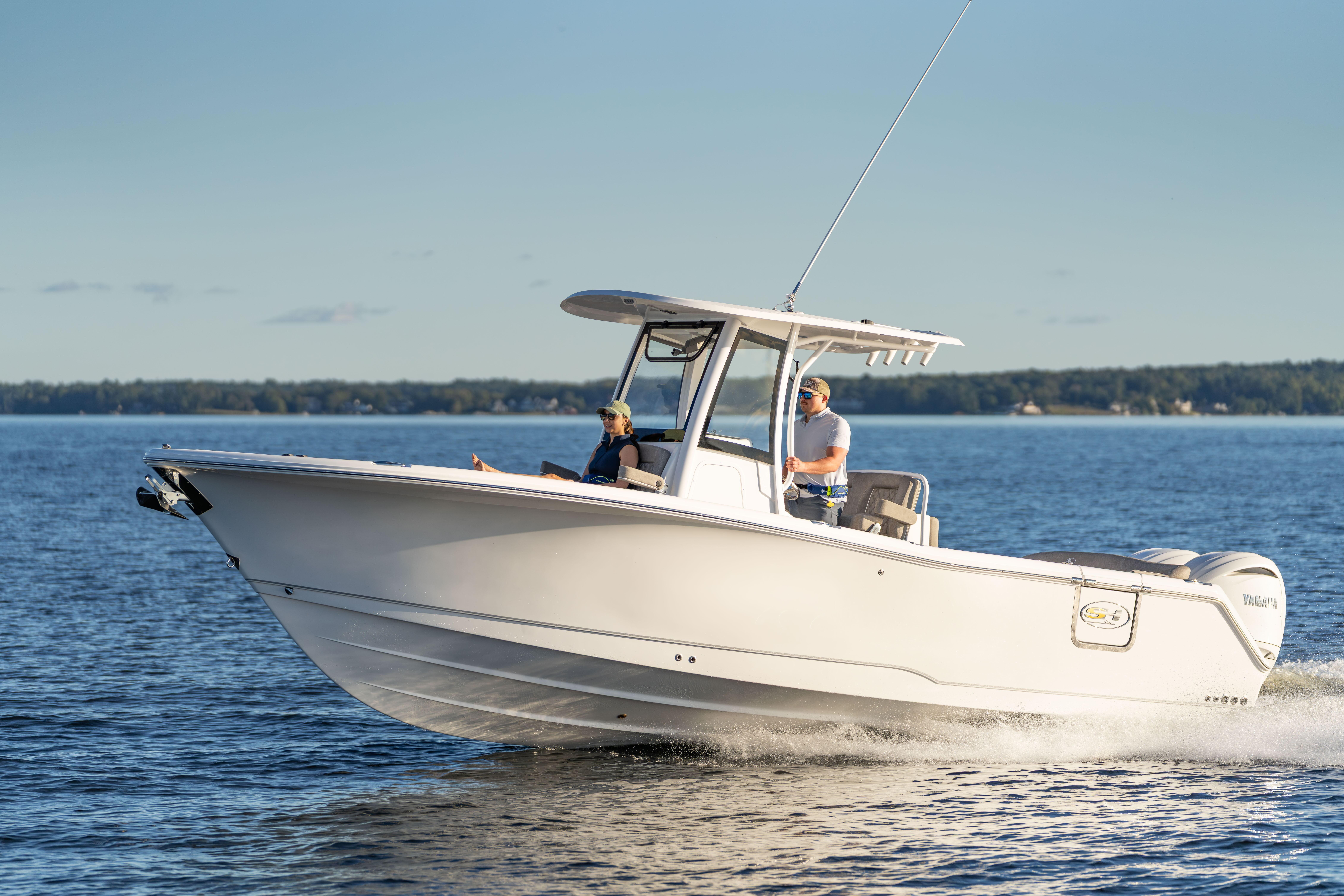 2026 Sea Hunt Ultra 275 Coffin Box cruising on a calm lake.