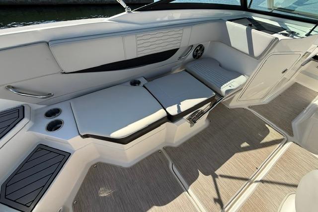 2022 Sea Ray SPX 210 Outboard interior with cushioned seating and cup holders.