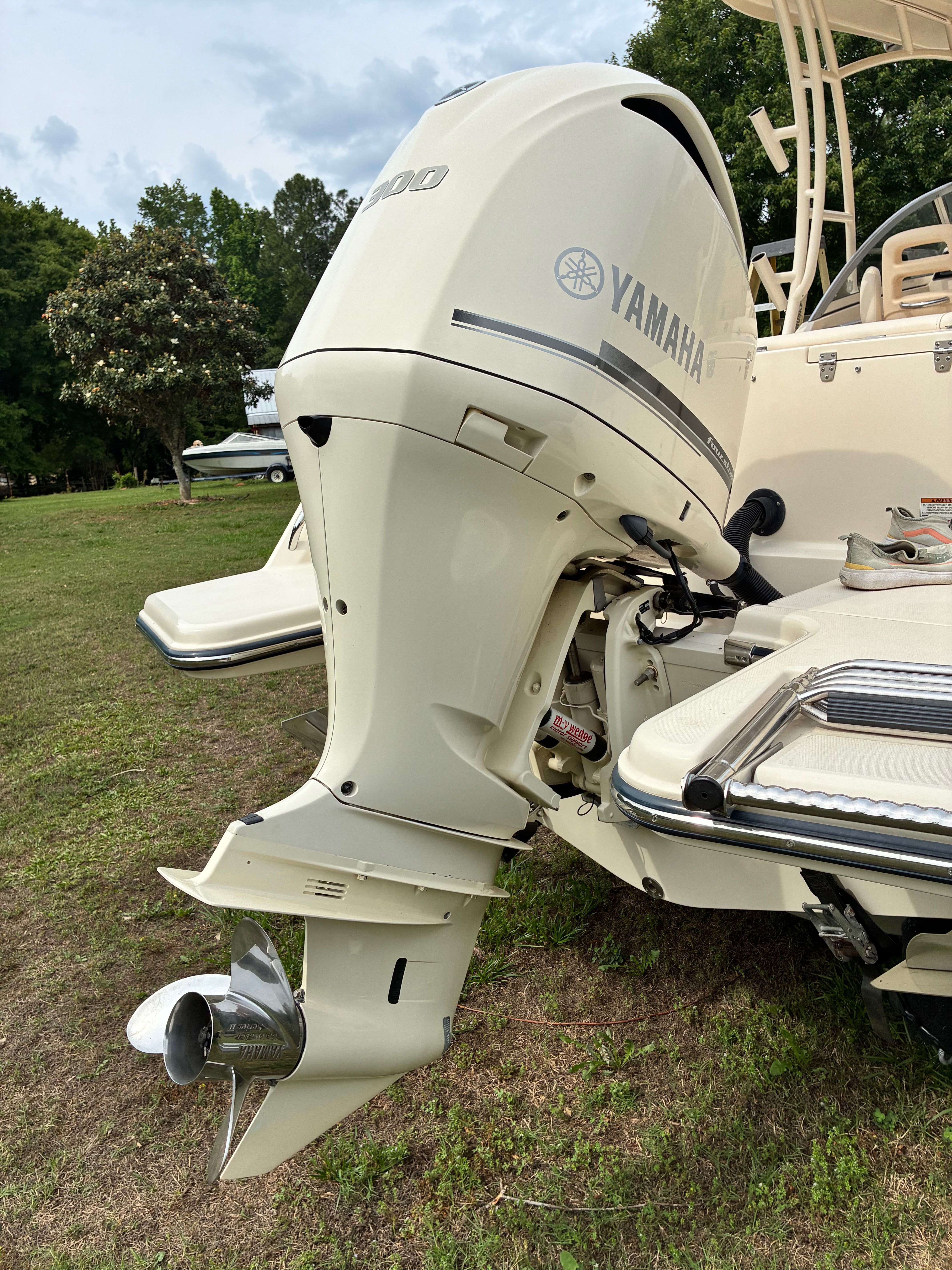 2018 Grady-White Freedom235 with Yamaha outboard motor on grass.