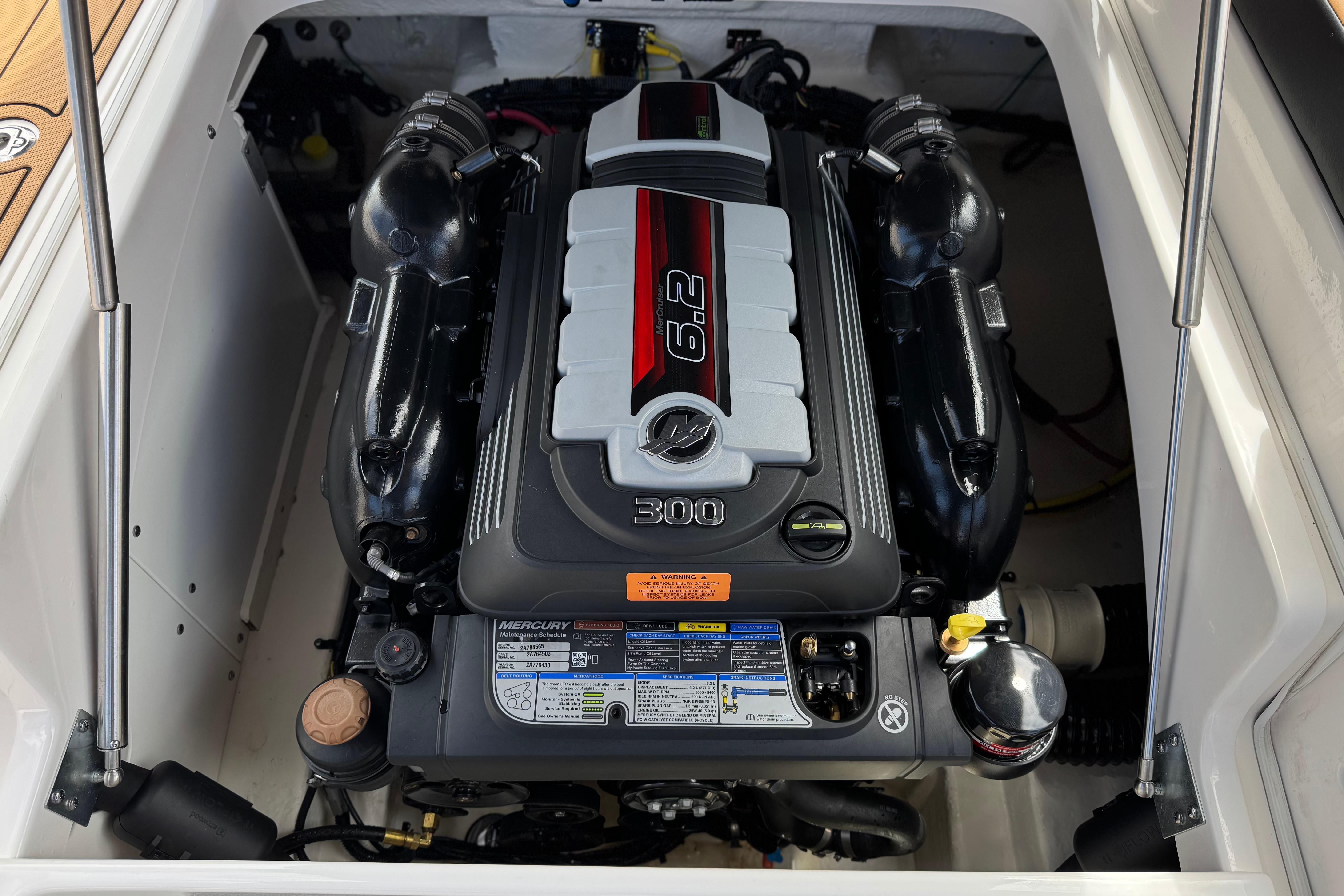 2024 Chaparral 247 SSX boat engine compartment with Mercury 6.2L 300 HP engine.