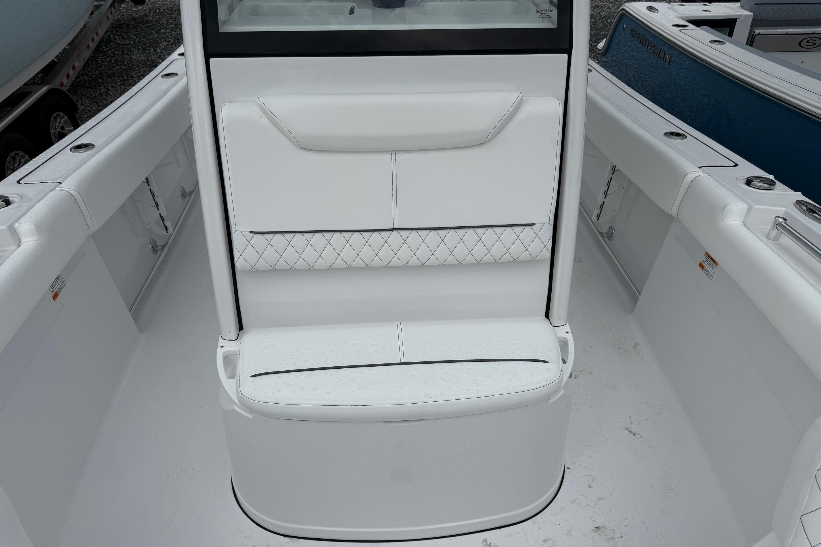 2026 Sportsman Heritage 231 Center Console boat interior with white seating and sleek design.