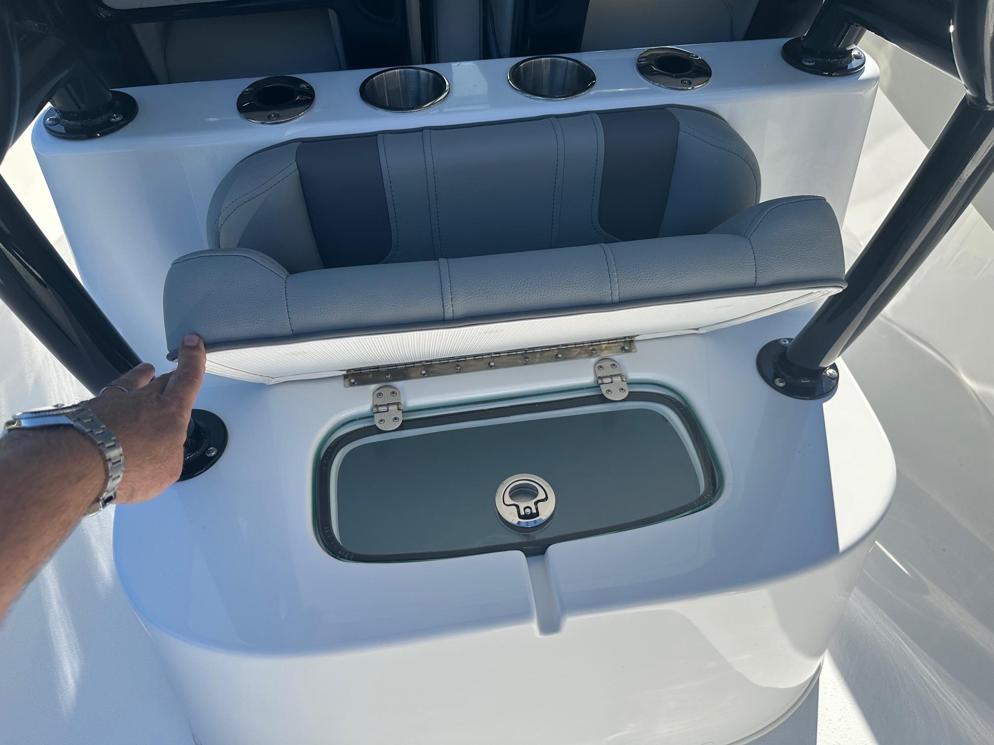 2025 Cape Horn 28XS boat seat with storage compartment and cup holders.