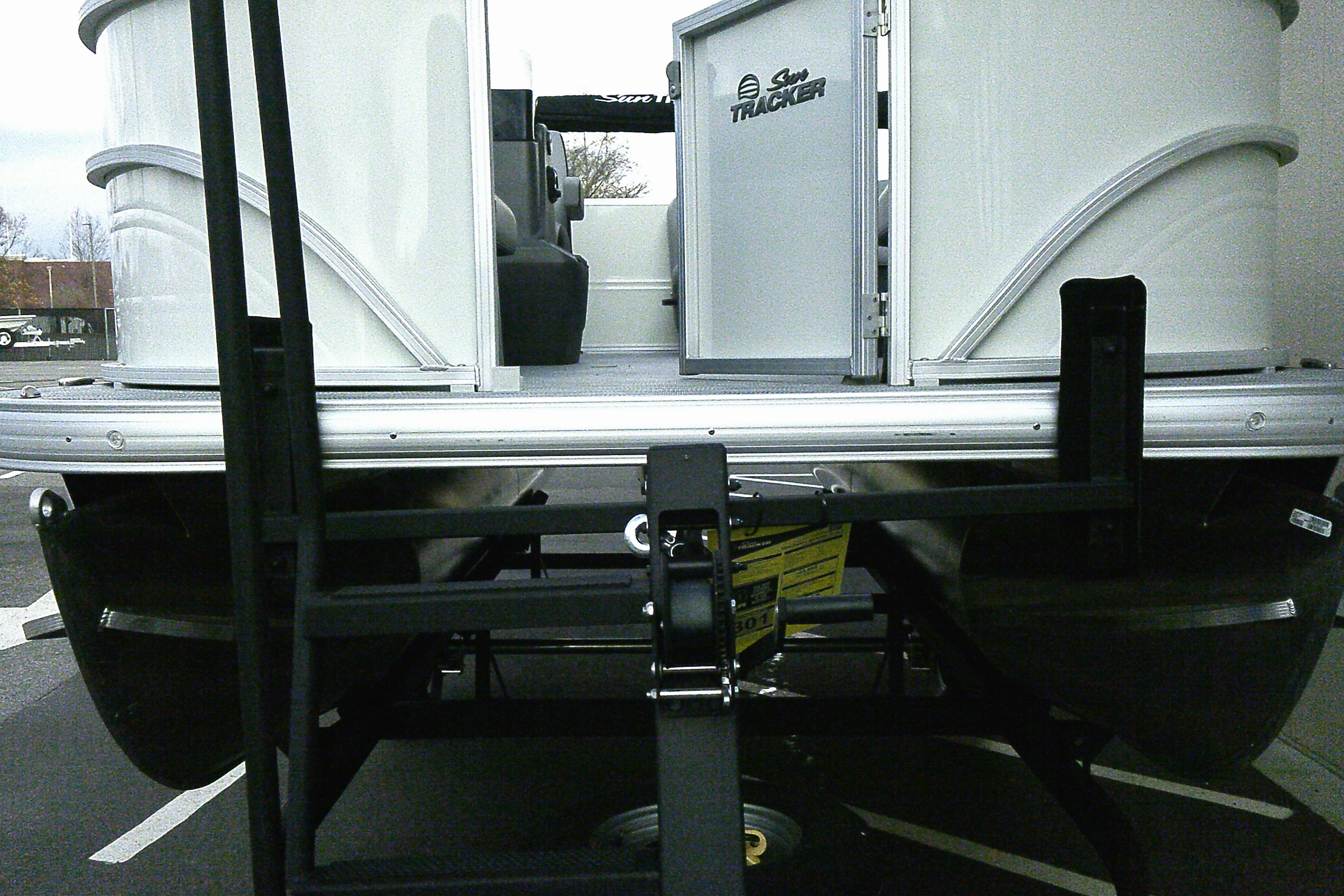 2026 Sun Tracker Party Barge 16 DLX pontoon boat on trailer, rear view.