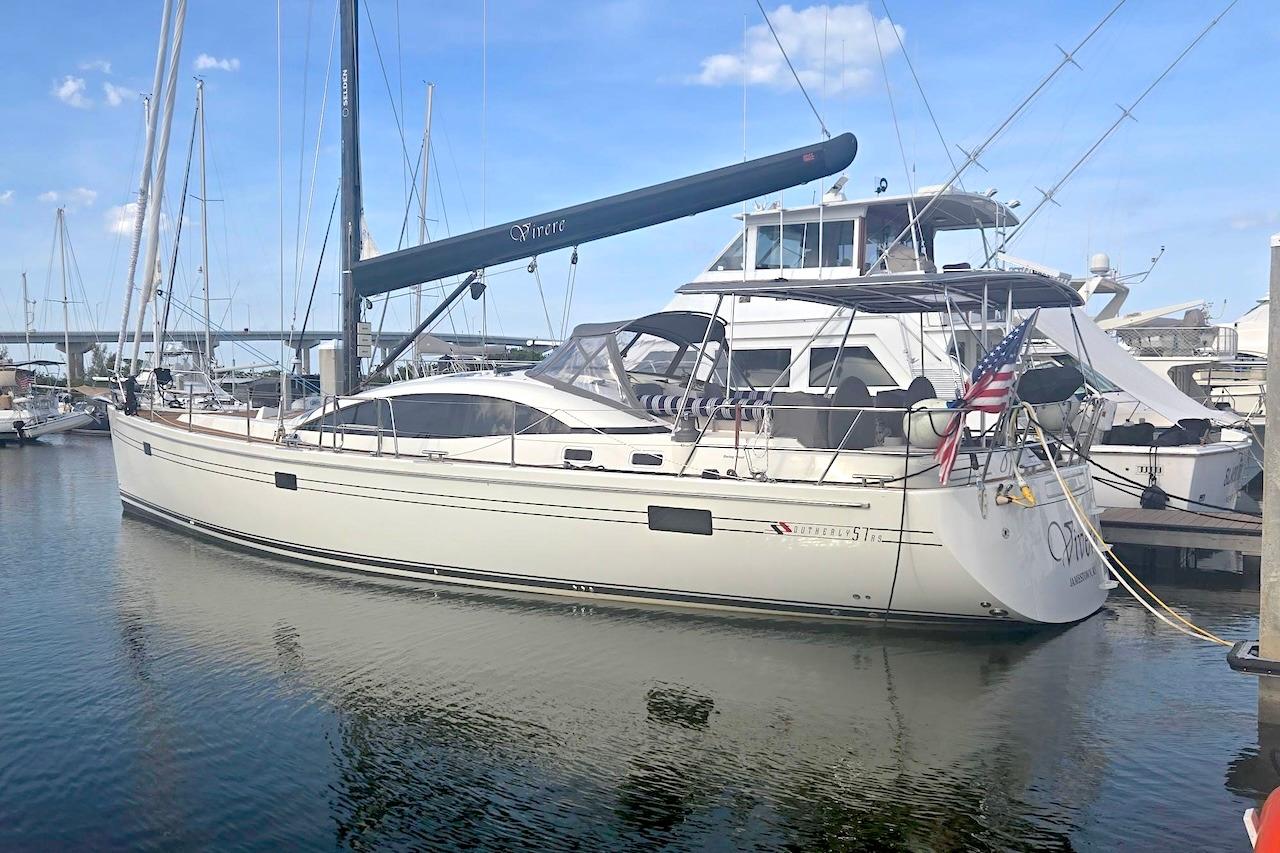 Sailing yacht Southerly 57 RS, 2011 model, docked at marina with clear skies.