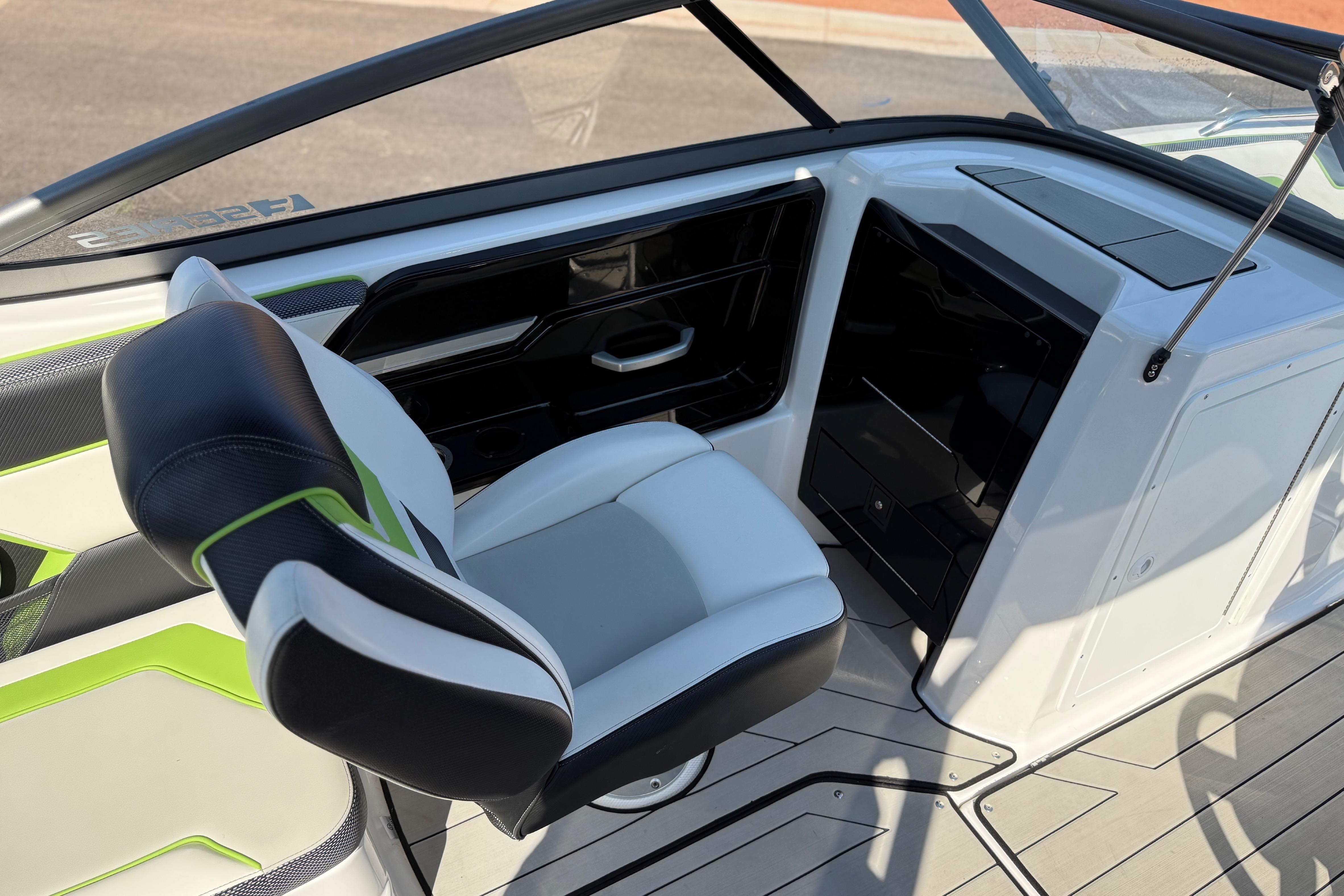 Interior of 2022 Yamaha Boats 212XE, featuring sleek seating and modern design elements.