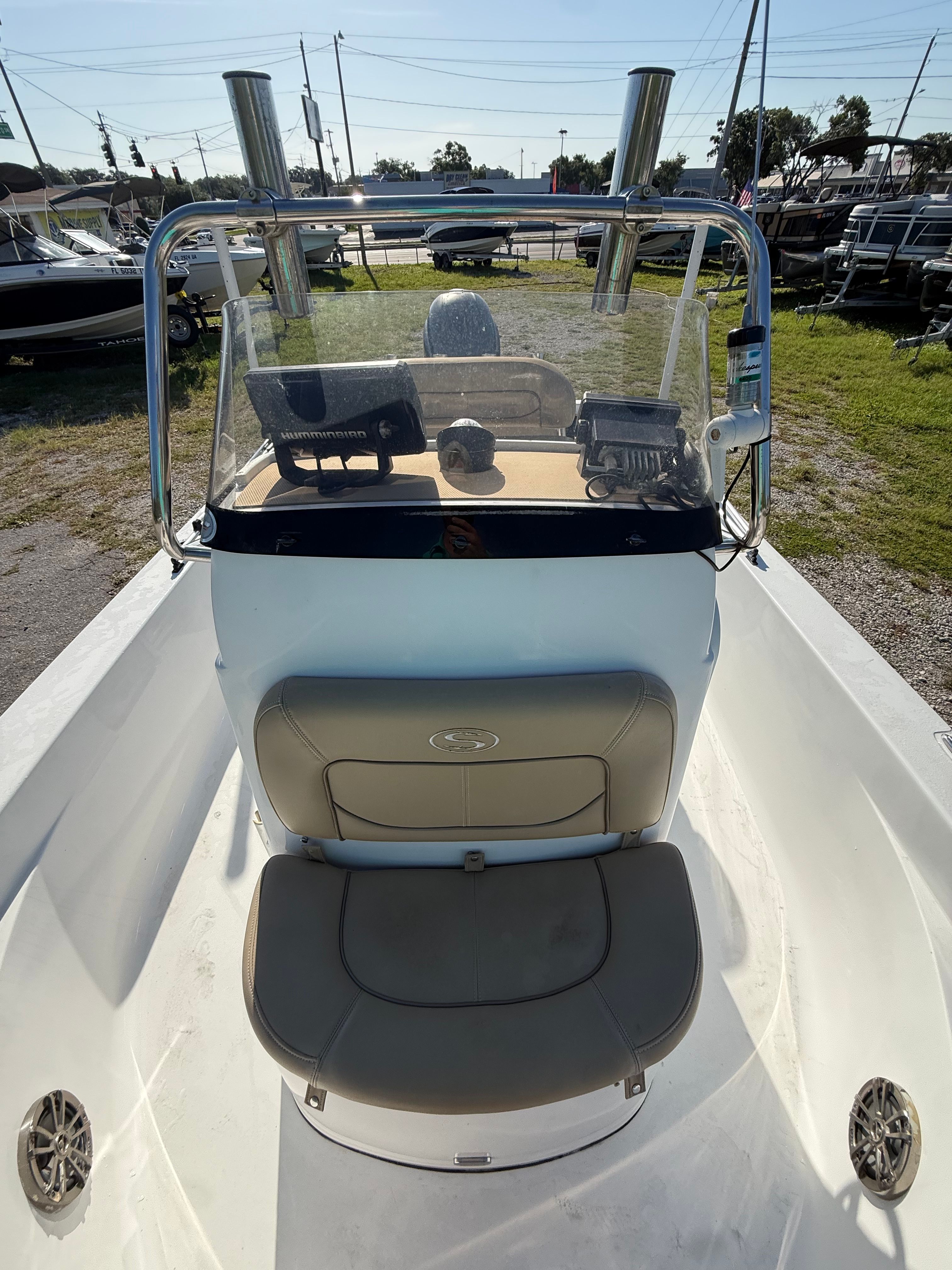 The image shows the cockpit of a 2016 Sportsman Masters 227 Bay Boat with a helm console and seating.
