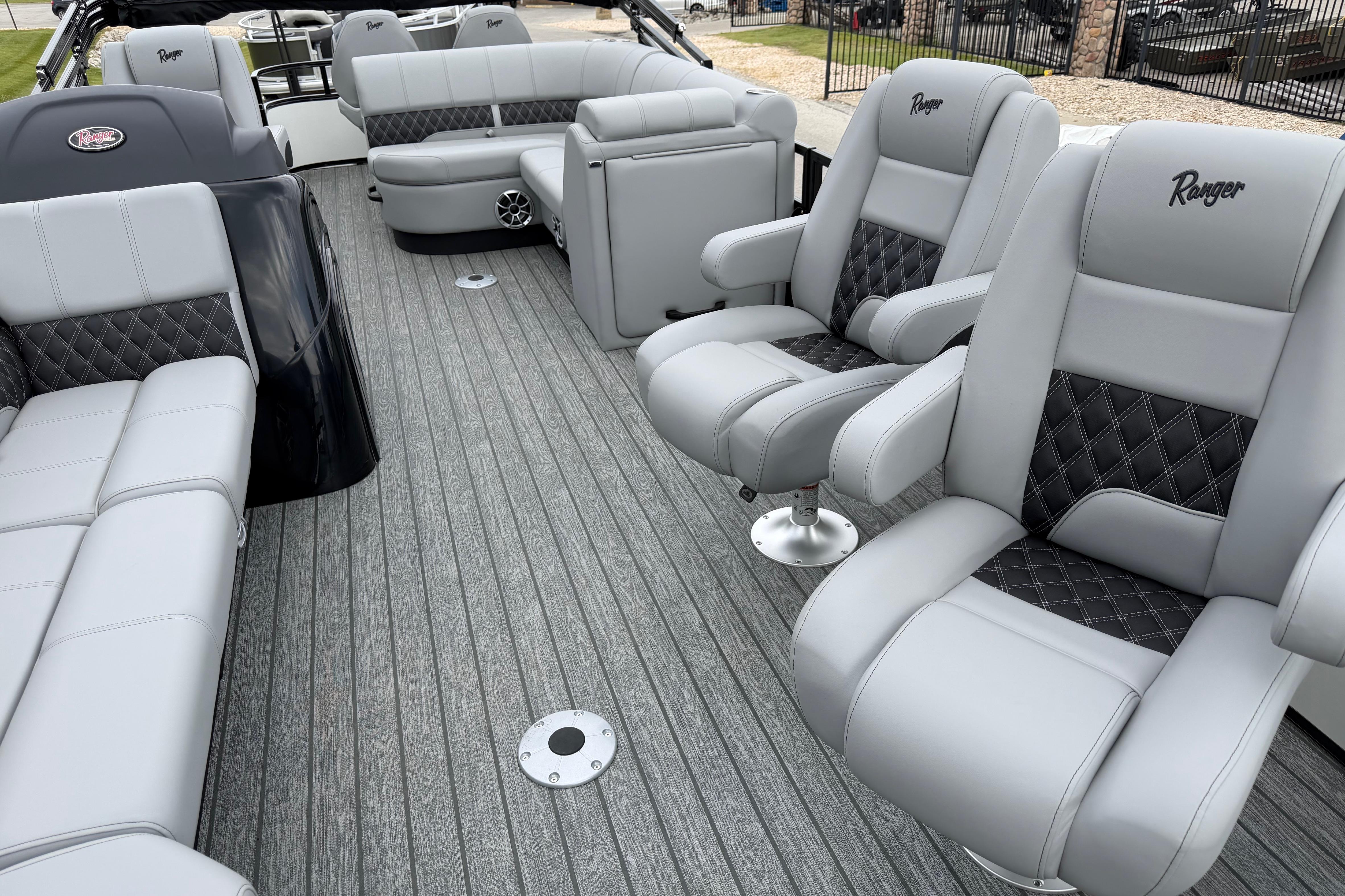 Luxurious interior of 2026 Ranger 220FC boat with plush seating and modern design.