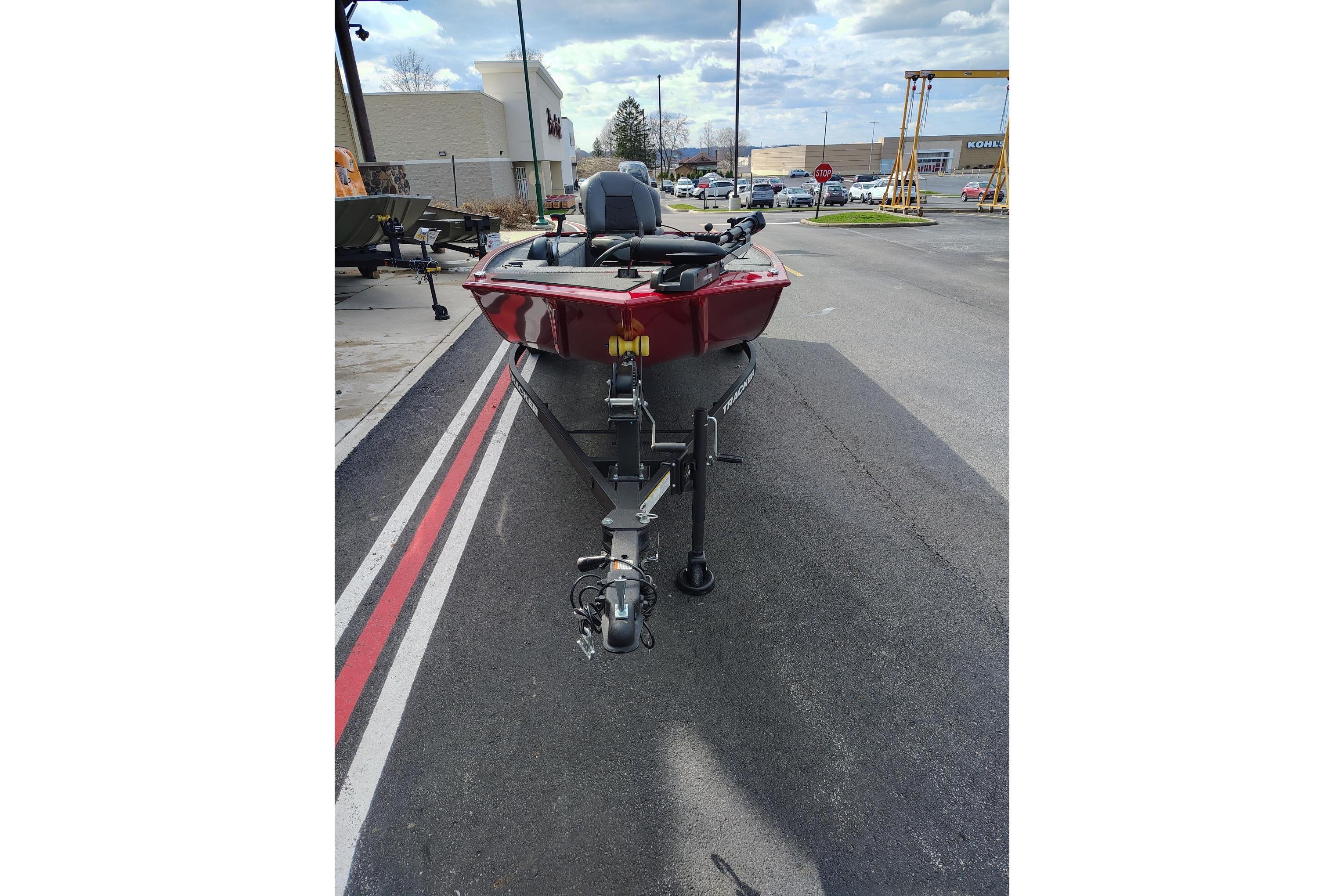 2025 Tracker Panfish 17 boat on trailer in parking lot.