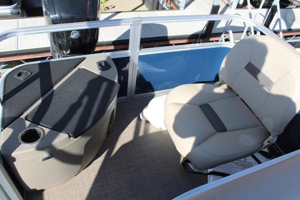 2024 Sun Tracker BB18 boat interior with beige seating and console.