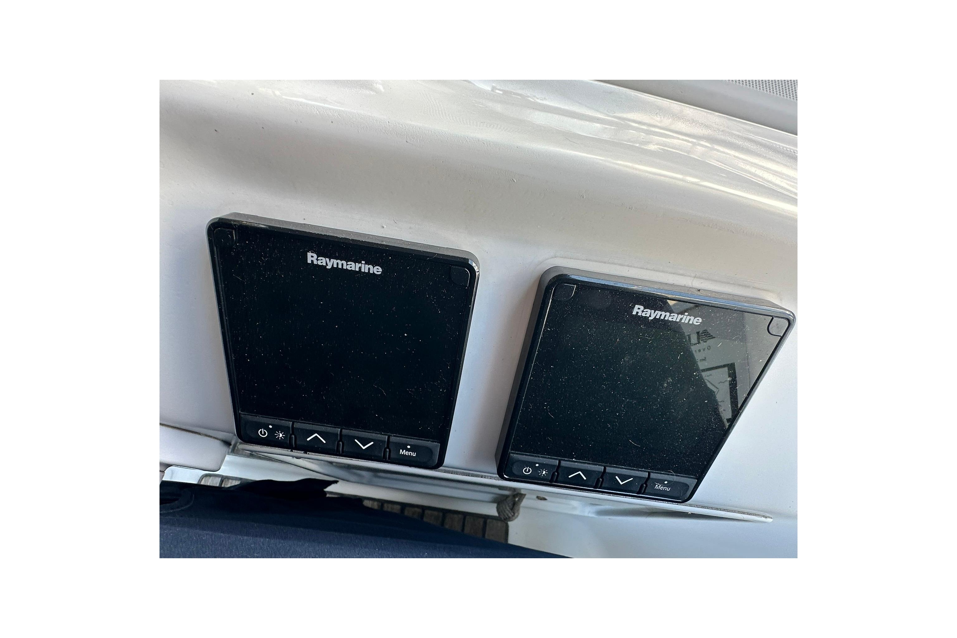 Raymarine navigation displays on a 2000 Beneteau 50 yacht dashboard.