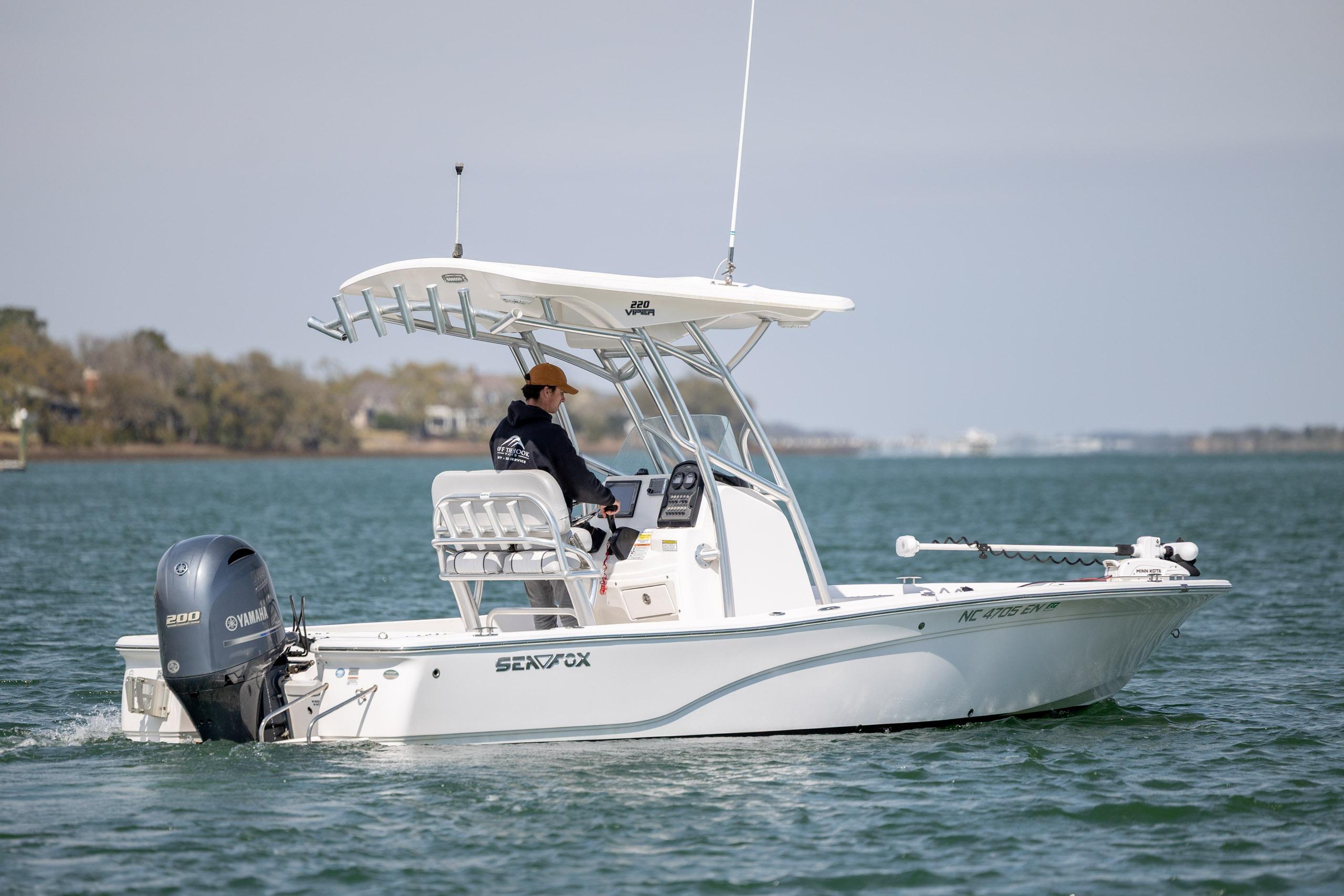 2019 Sea Fox 220 Viper boat cruising on calm waters with Yamaha engine.