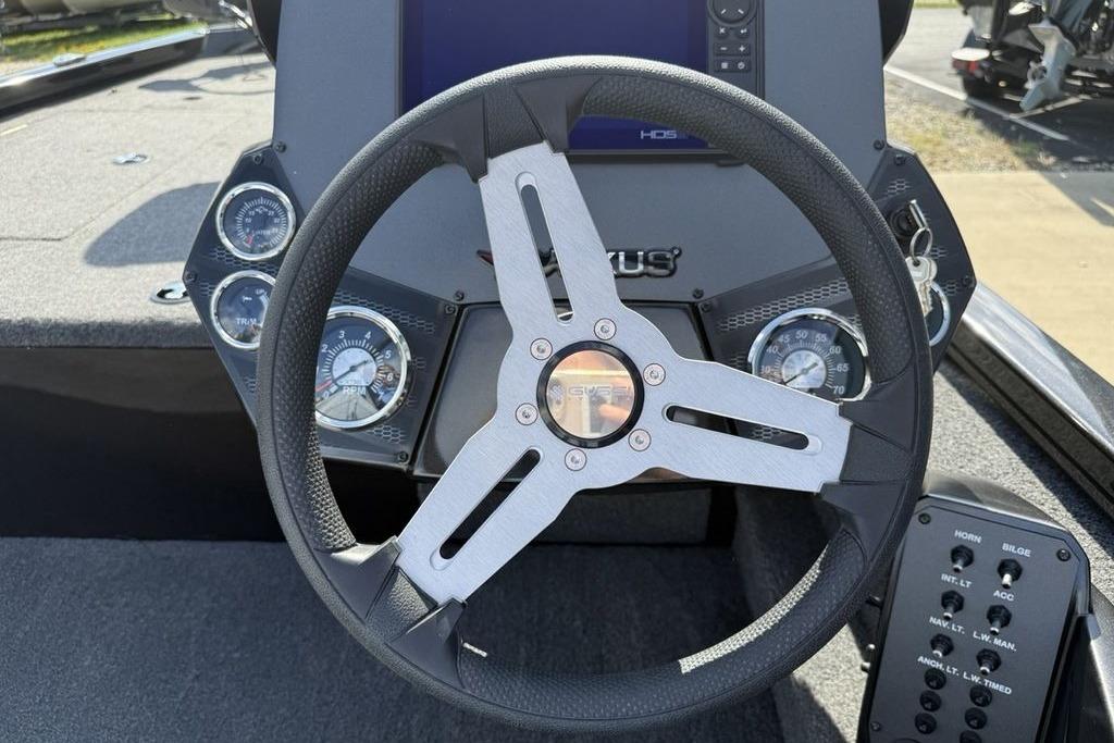 2023 Vexus AVX189 boat dashboard with steering wheel and instrument panel.