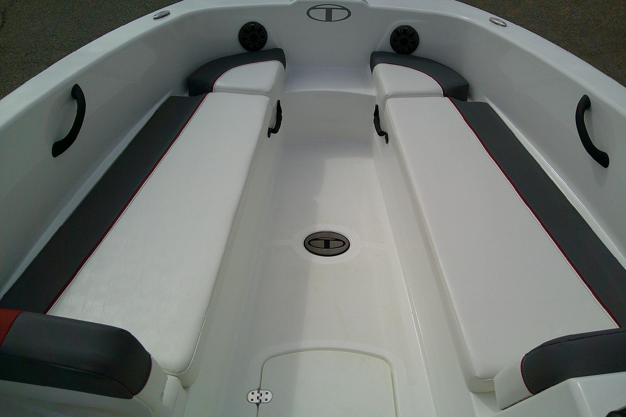 2024 Tahoe T18 boat interior with white and gray seating, featuring red accents.