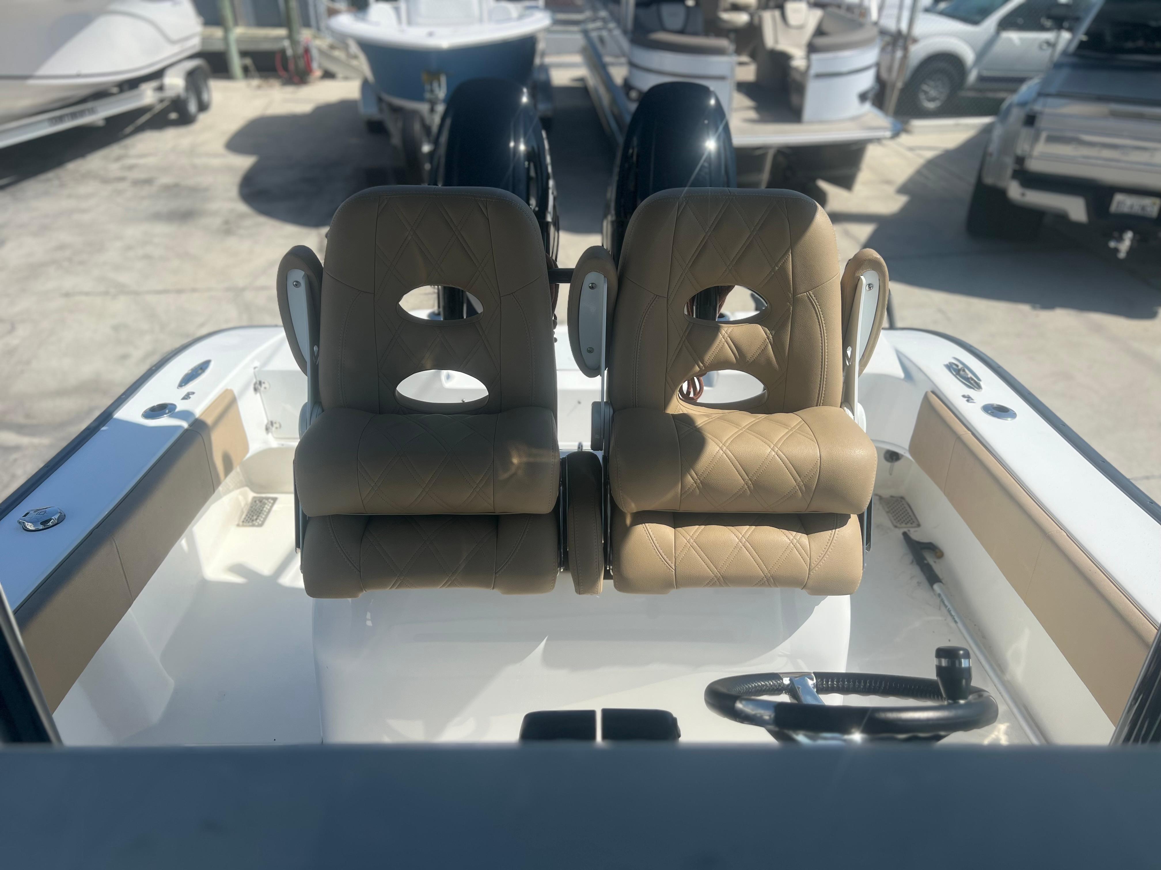 2022 Cape Horn 24 XS boat interior with dual tan seats and steering wheel.