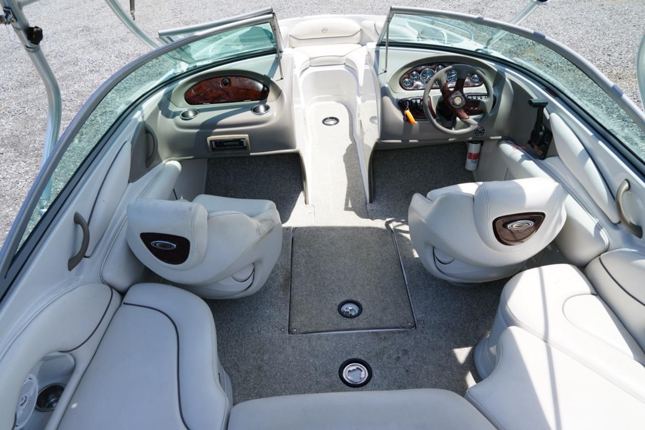 2004 Crownline 216 LS boat interior with plush seating and modern dashboard.