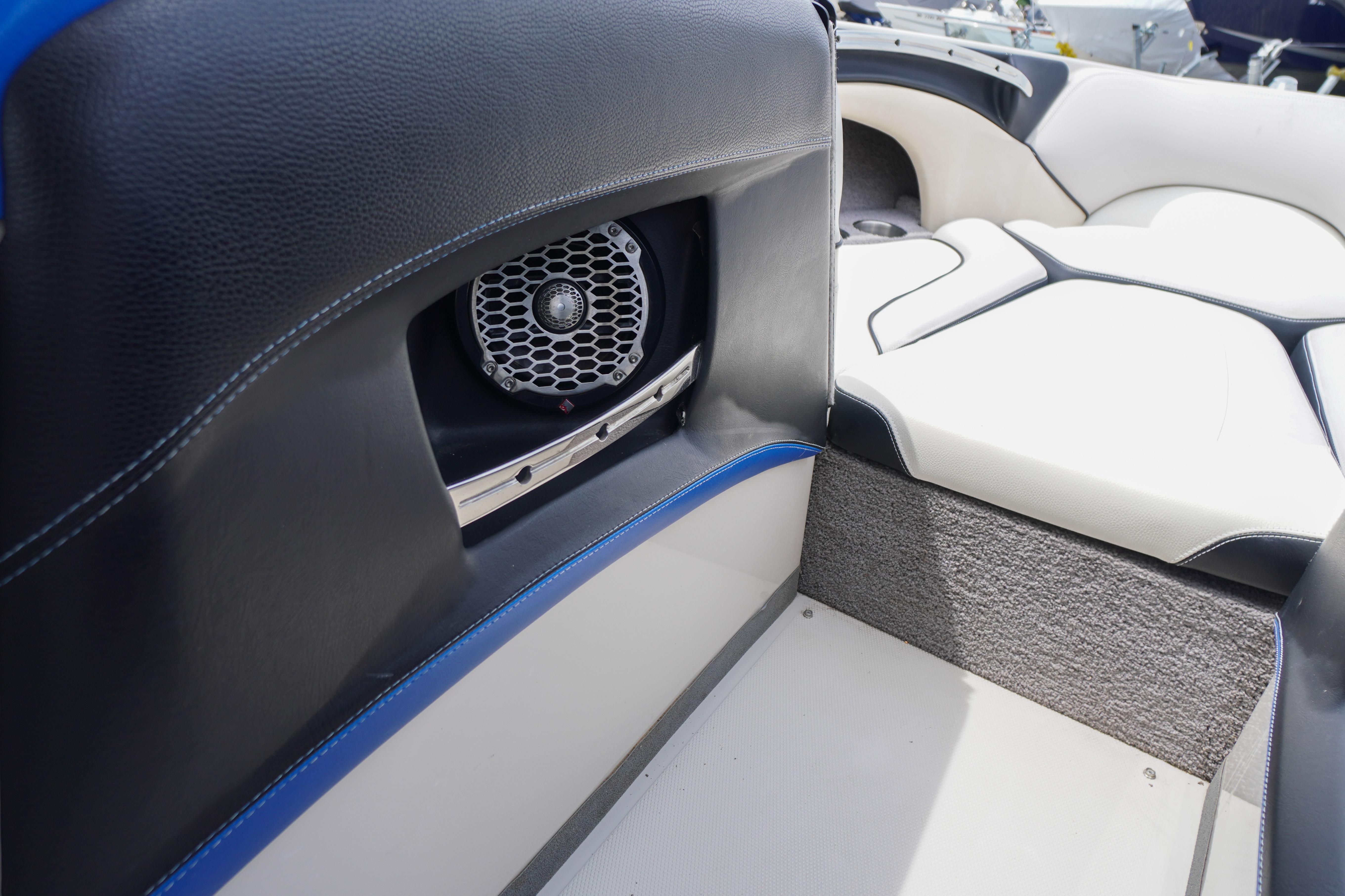 Interior of 2011 Malibu Wakesetter 21 VLX boat with speaker and seating.