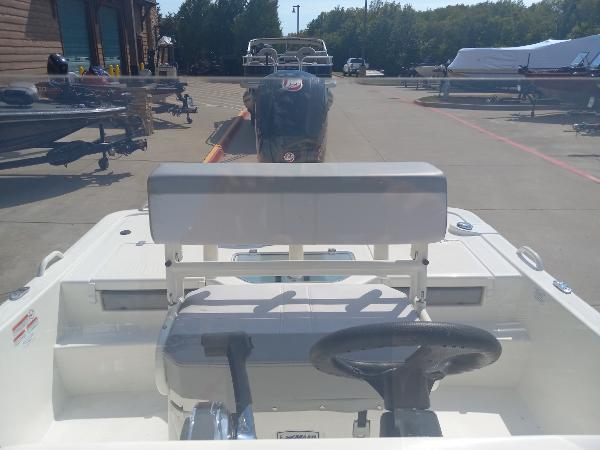 2024 Mako Pro Skiff 19 CC boat interior with steering wheel and seating.
