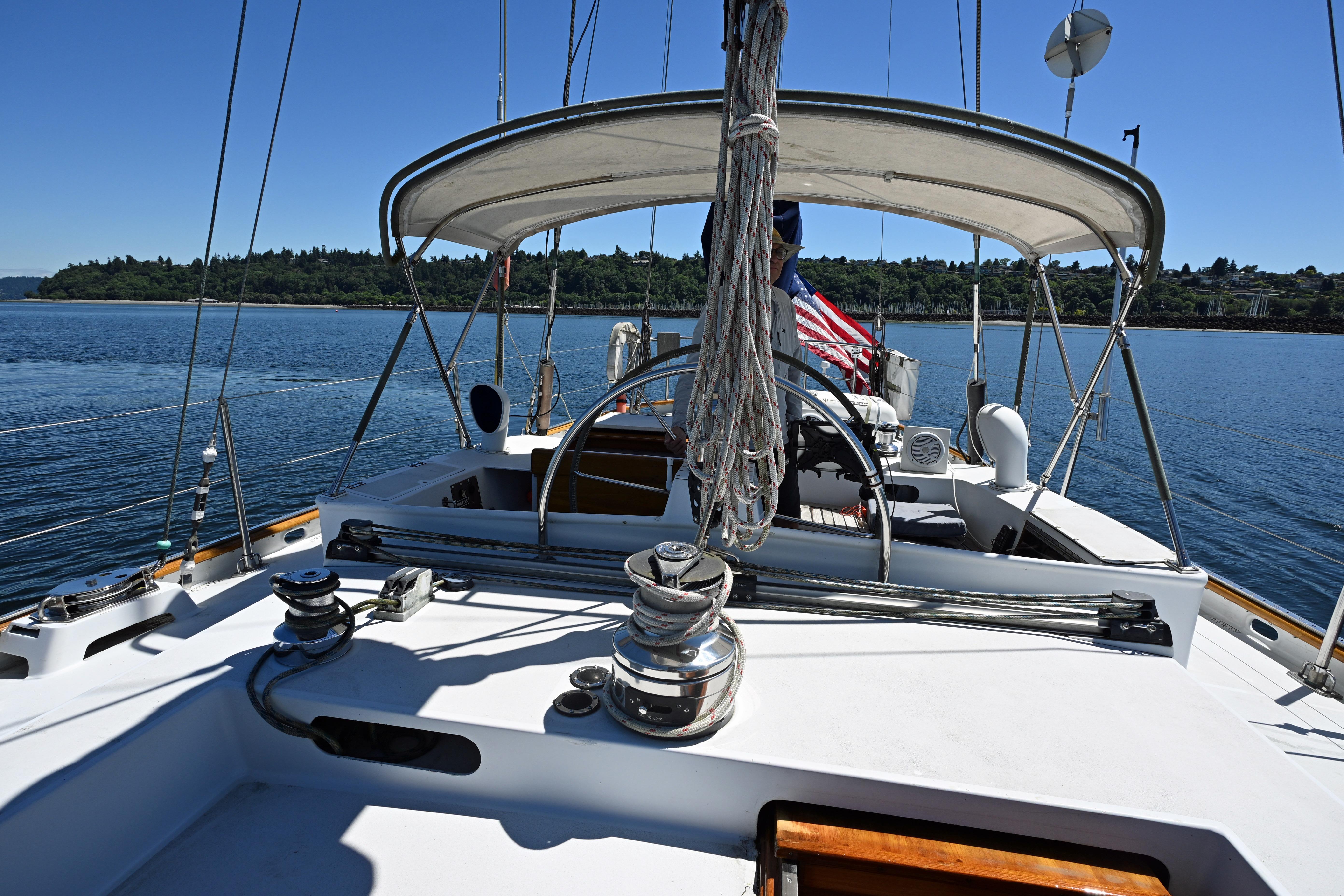 Sailing yacht Abeking & Rasmussen Tripp 74, 1968 model, cruising on calm waters under clear skies.