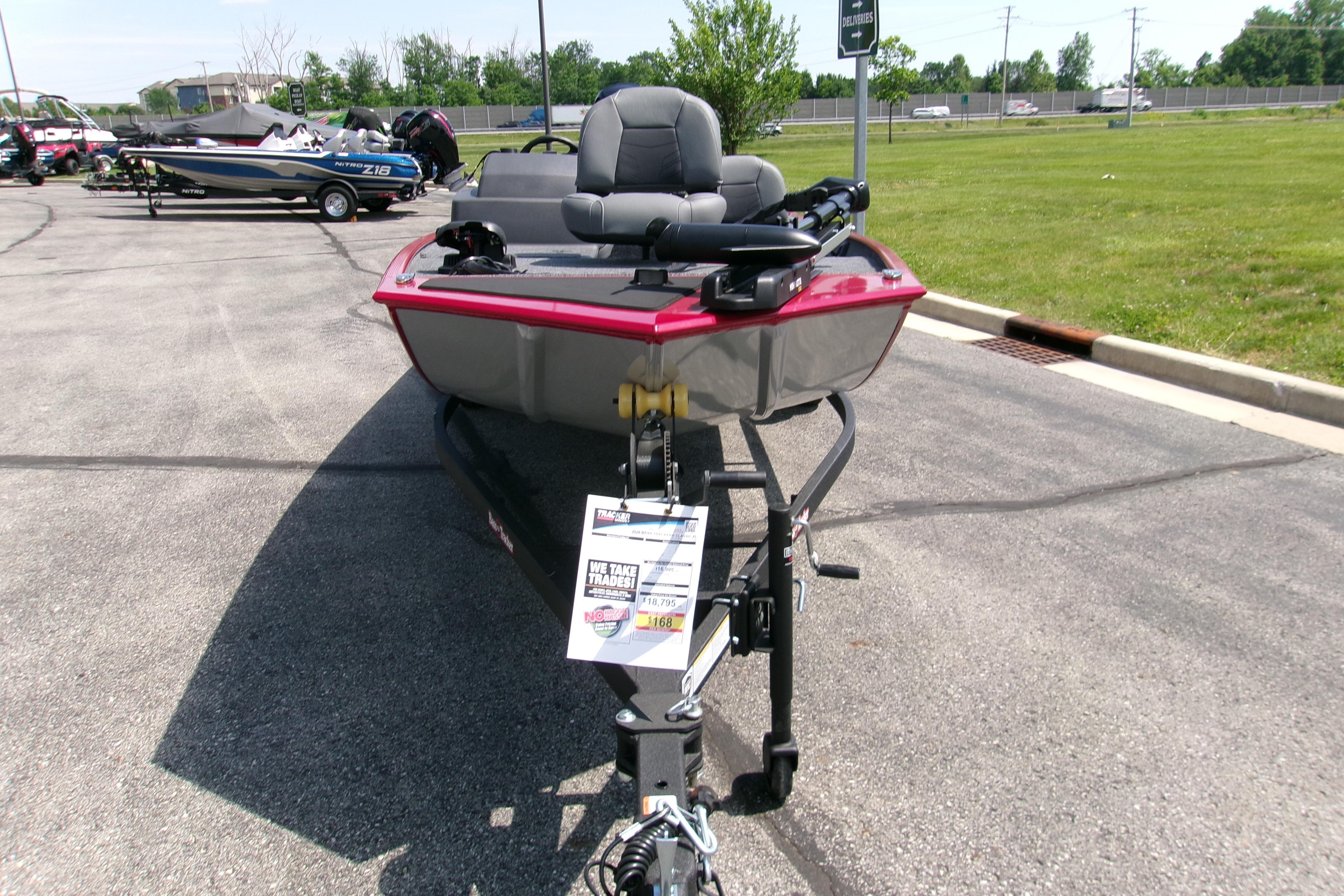 2026 Tracker Bass Tracker Classic XL boat on display in a parking lot.