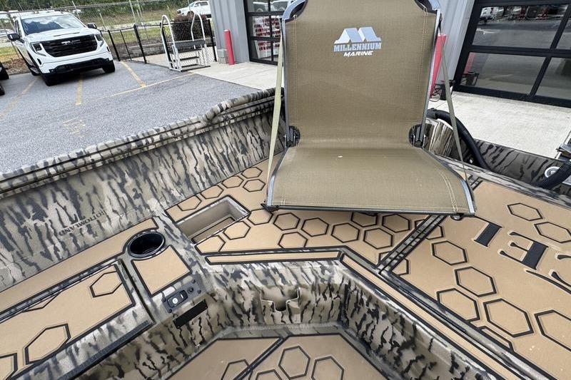 2026 Excel 183 Tomahawk boat interior with Millennium Marine seat and hexagonal pattern design.