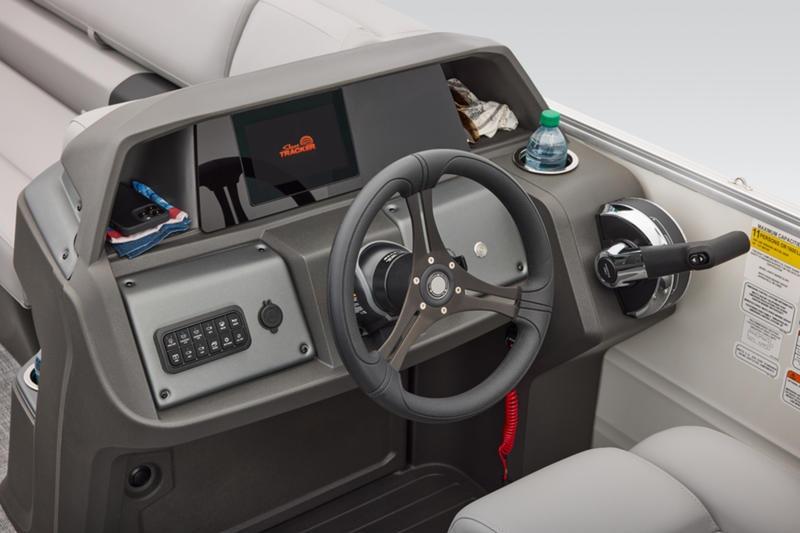 2026 Sun Tracker Party Barge 22 DLX helm with steering wheel and control panel.