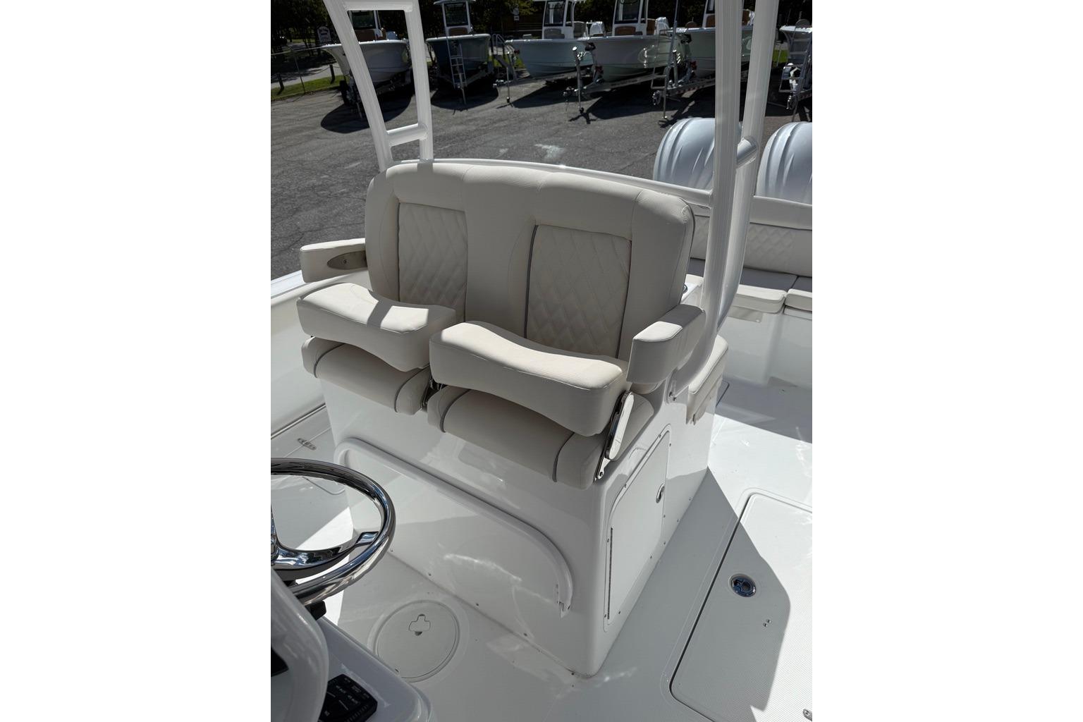2026 Sea Hunt Ultra 285 Coffin Box boat seating area with steering wheel.