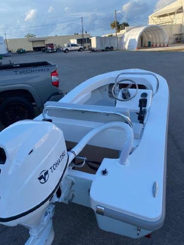 2024 Ultra Lite Tenders ULT 380 boat with Tohatsu motor, parked outdoors.