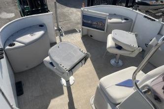 2023 Suntracker G3 Select 322 CC boat interior with seating and helm.