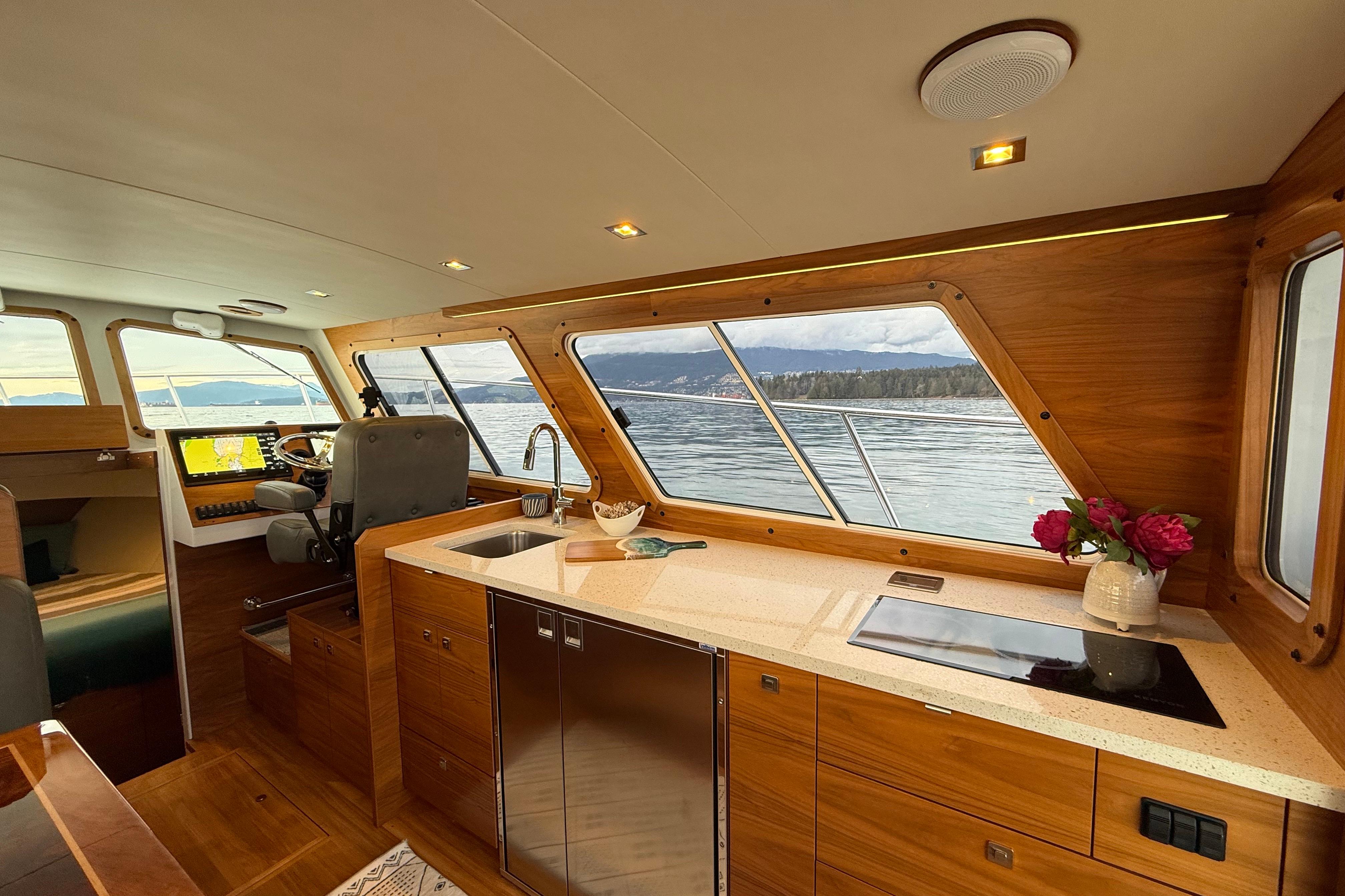 Luxurious interior of 2022 Coastal Craft 33 ProFish yacht with scenic ocean view.