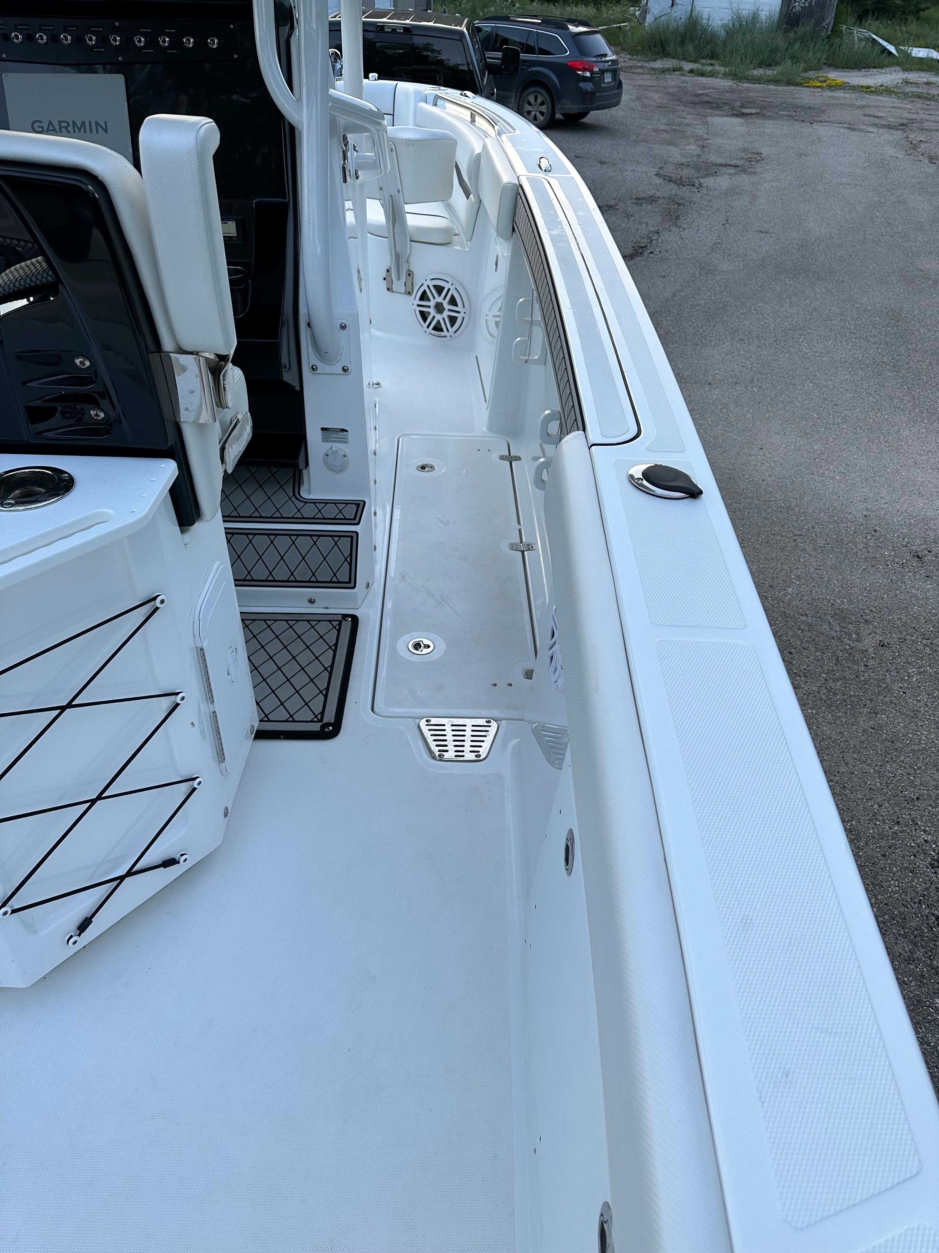 2021 Wellcraft 262 Fisherman boat deck with seating and storage compartments.