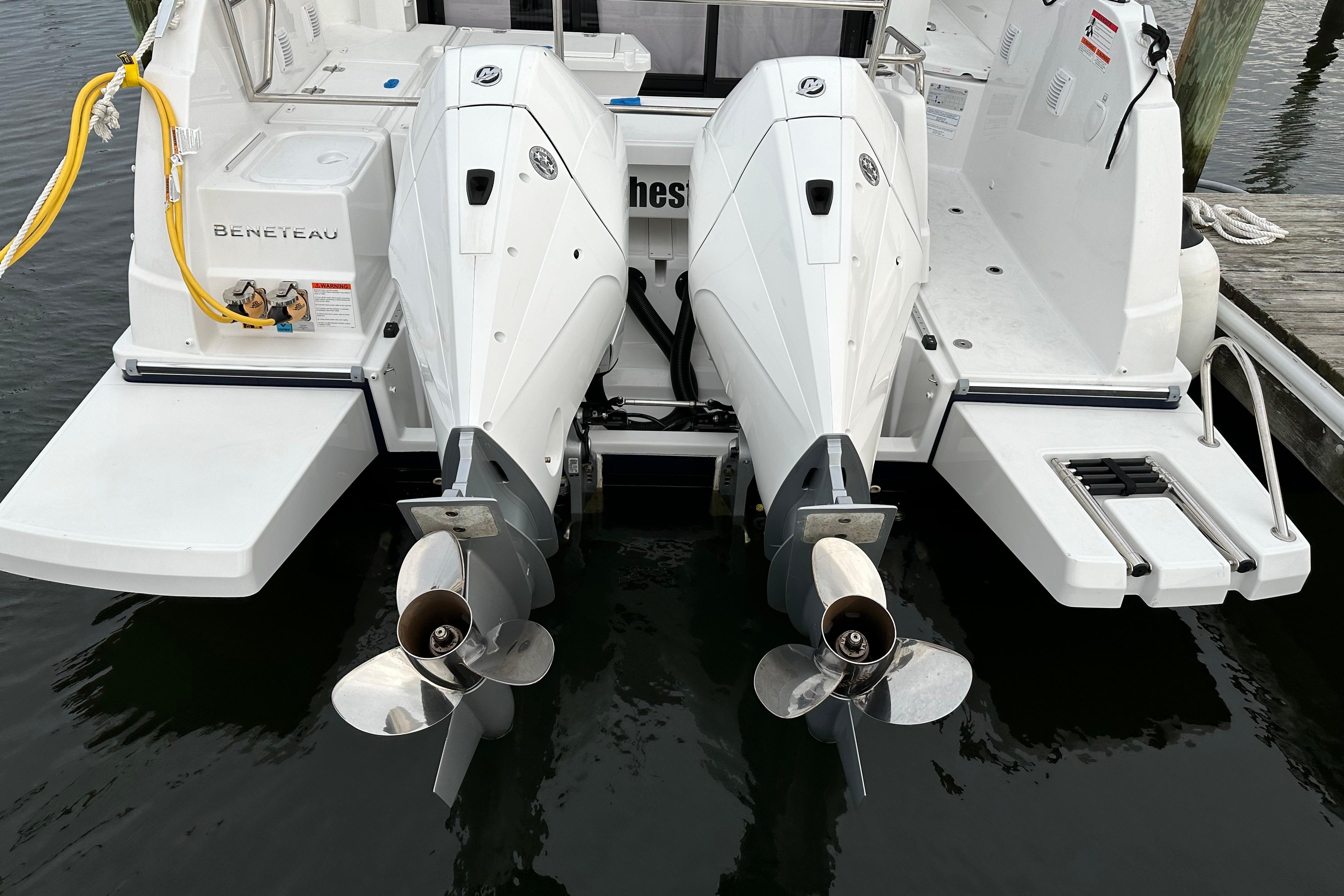 2024 Beneteau Antares 9 boat with dual outboard engines at dock.