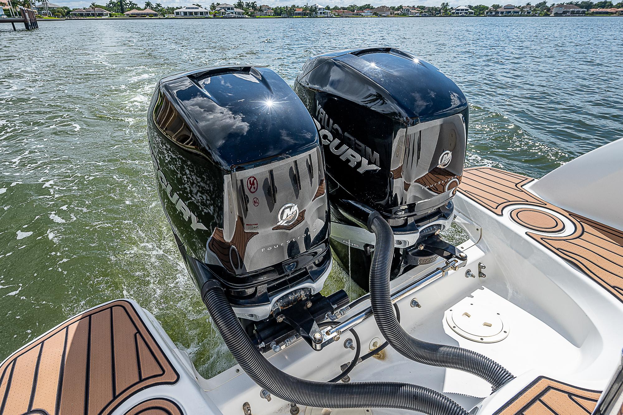 2018 Boston Whaler 270 Vantage with twin Mercury outboard engines on water.