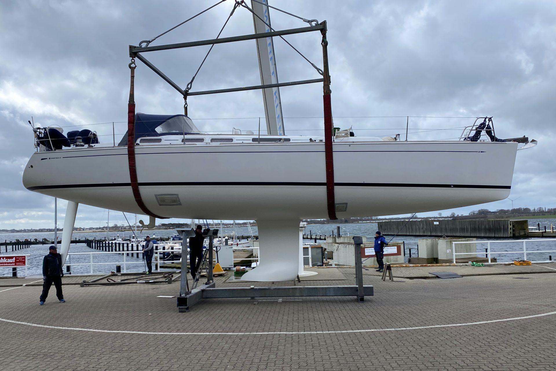 2004 Grand Soleil 45 J&V yacht being lifted at a marina.