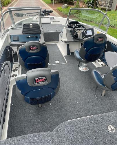 2025 Ranger 1850MS boat interior with blue seats and steering console.