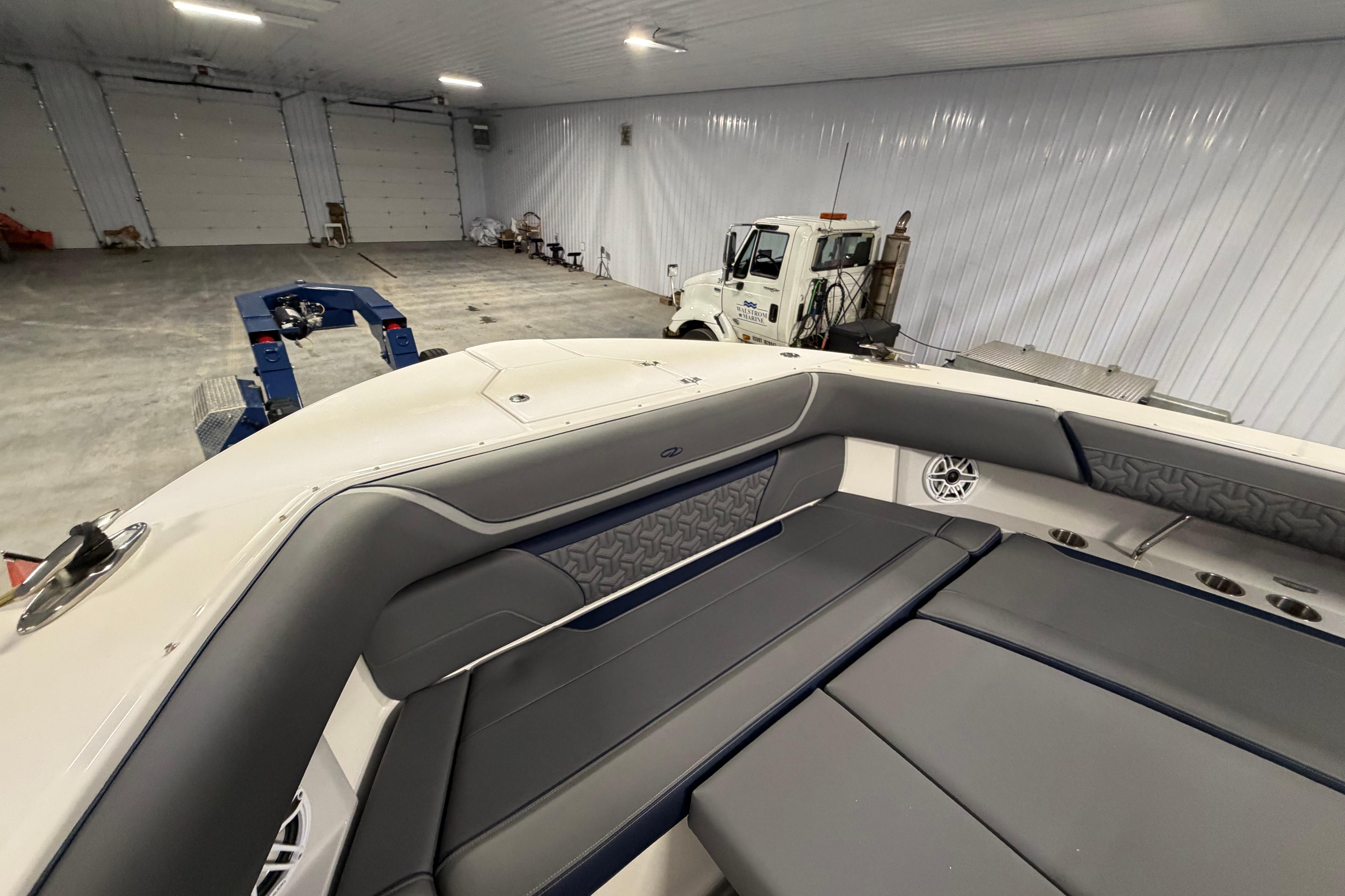 2027 Regal 38 Surf boat interior in a spacious garage setting.