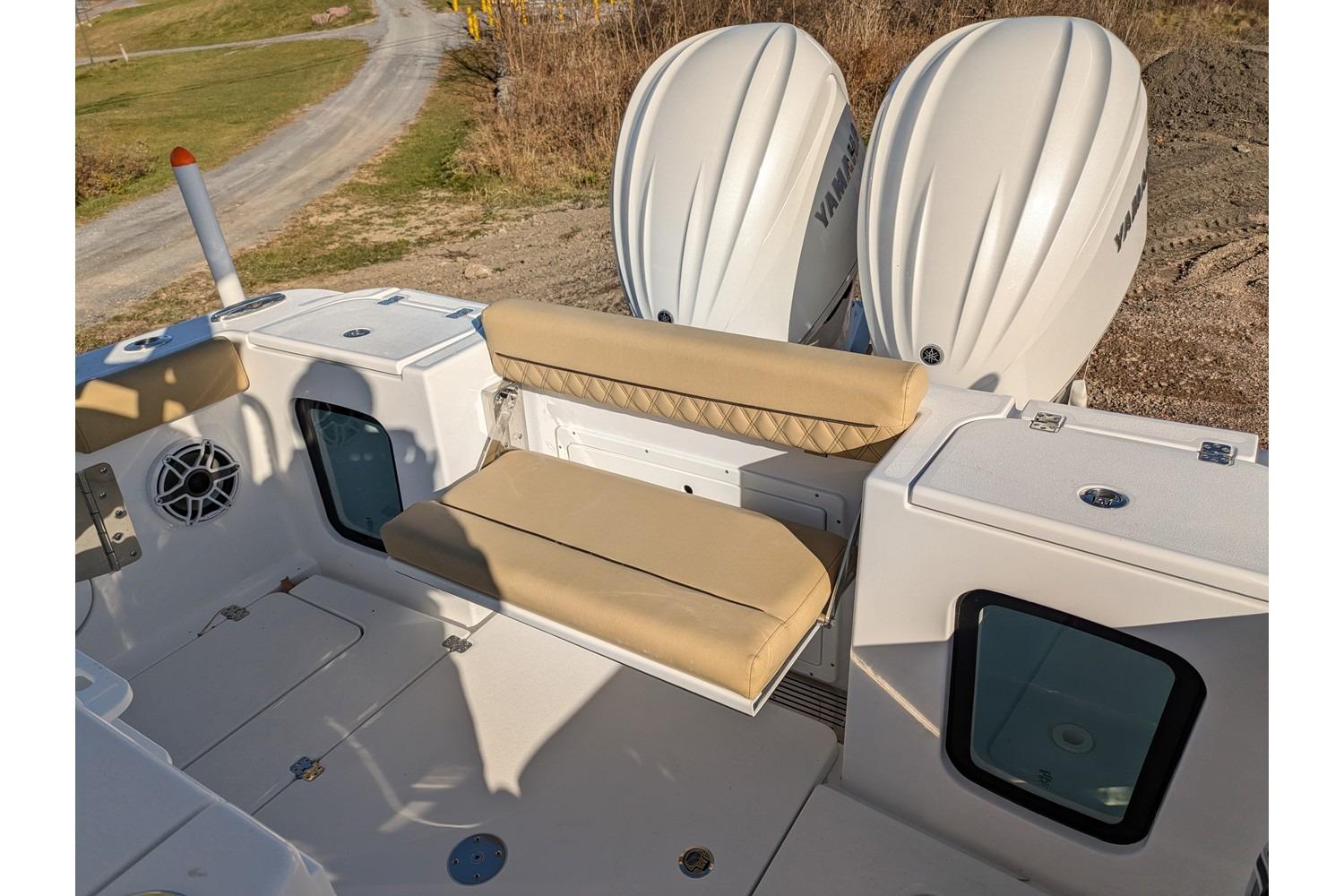 2025 Sportsman Open 282 Center Console boat with dual engines and cushioned seating.