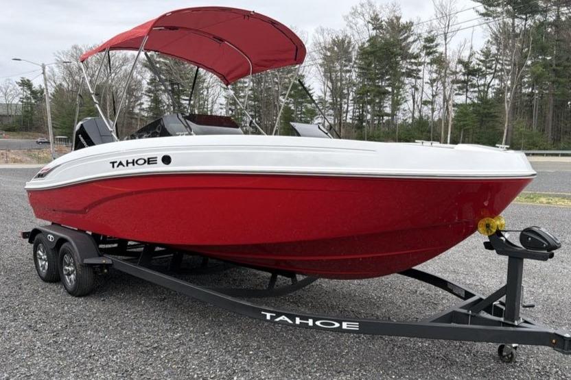 2026 Tahoe T21 boat with red hull and canopy on a trailer.