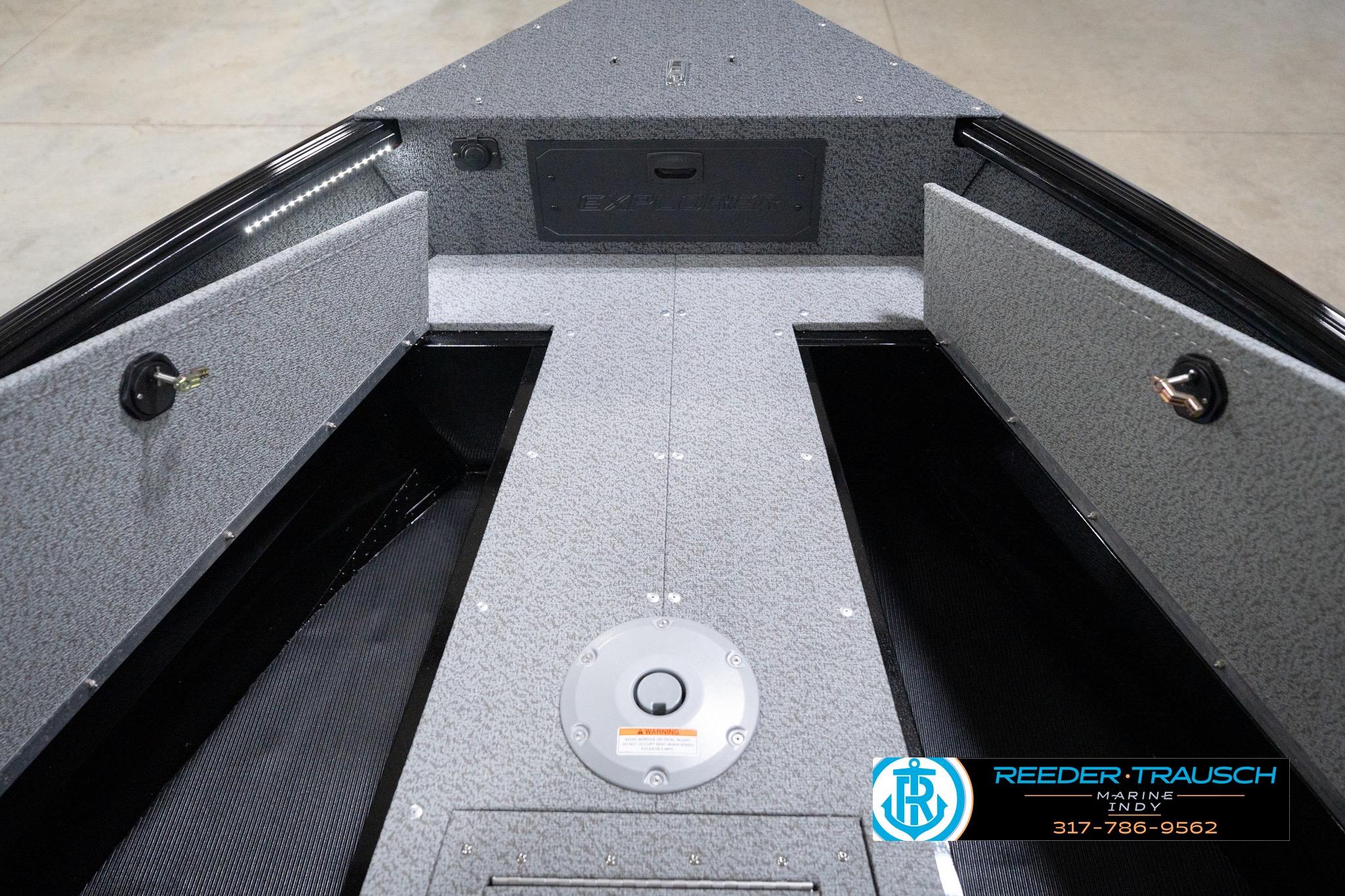 2026 Lund 1800 Explorer Sport boat interior with storage compartments and Reeder-Trausch Marine logo.