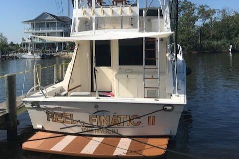 1989 Viking 41 Sportfish Convertible at dock, rear view.